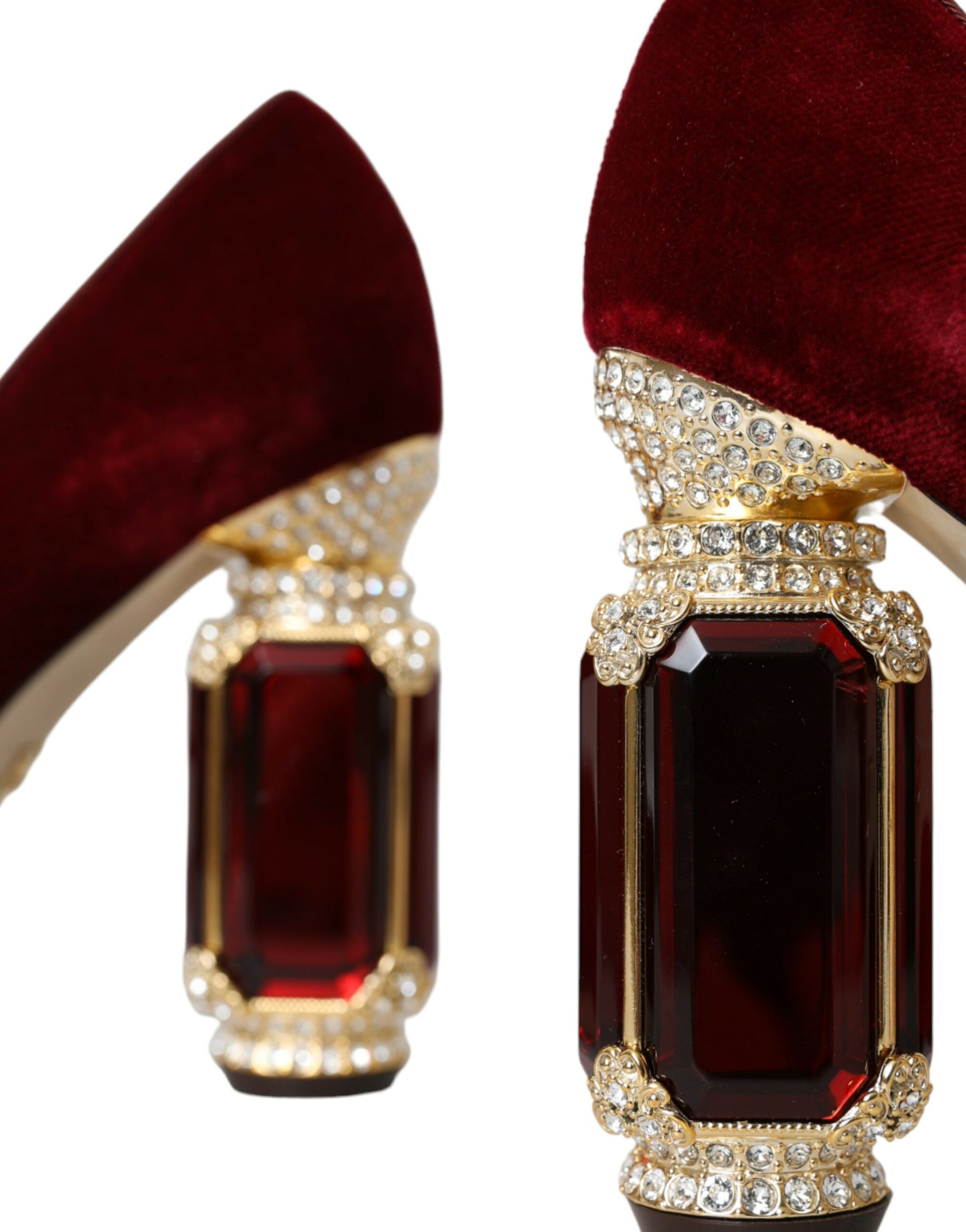 Pair of red velvet shoes with diamond embellishments and large gemstones on heels