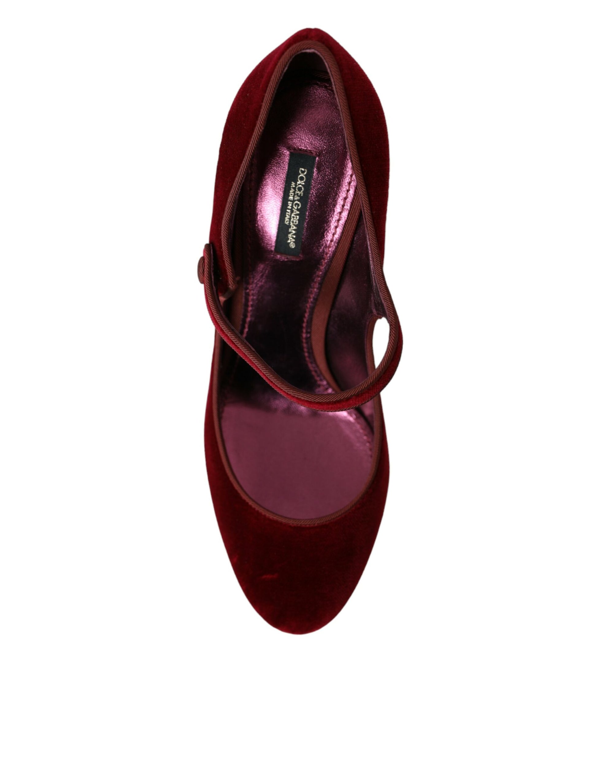 Pair of burgundy velvet shoes with gold buckle and strap