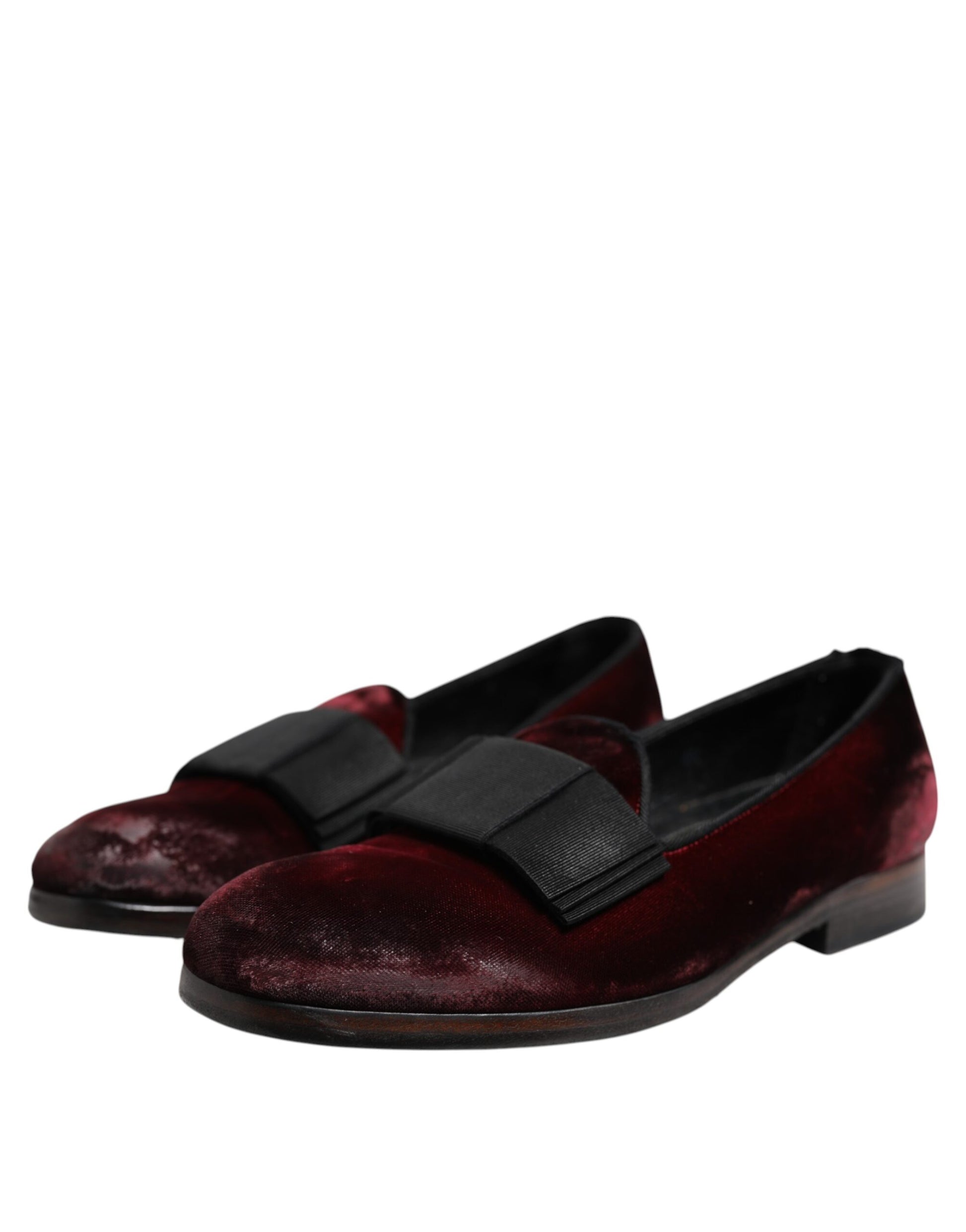 A pair of red velvet men's slip-on loafers with black straps