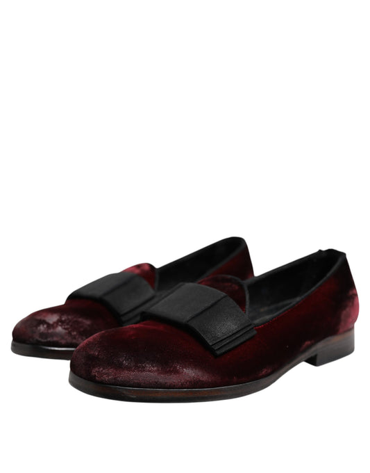A pair of red velvet men's slip-on loafers with black straps