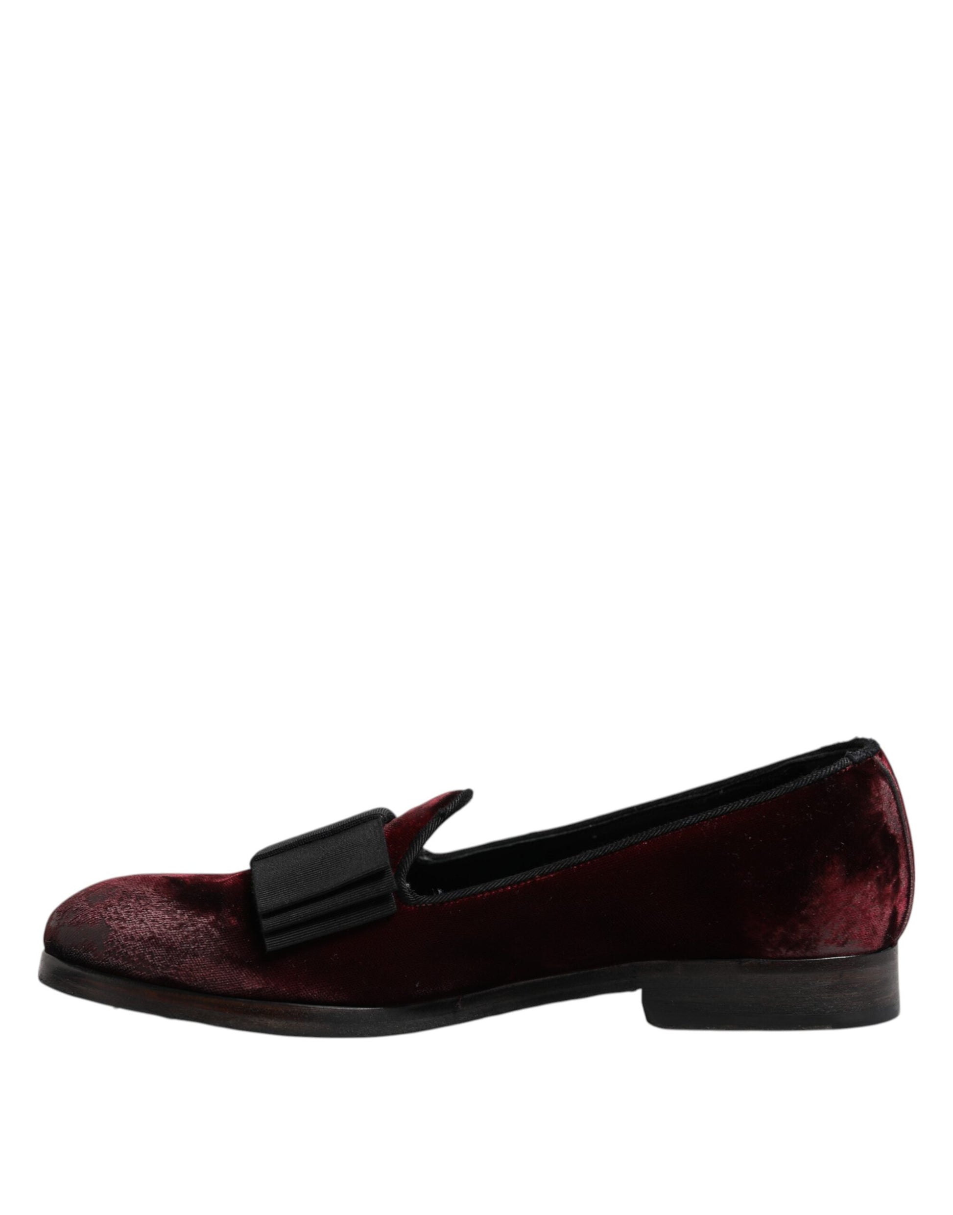 A pair of red velvet men's slip-on loafers with black soles