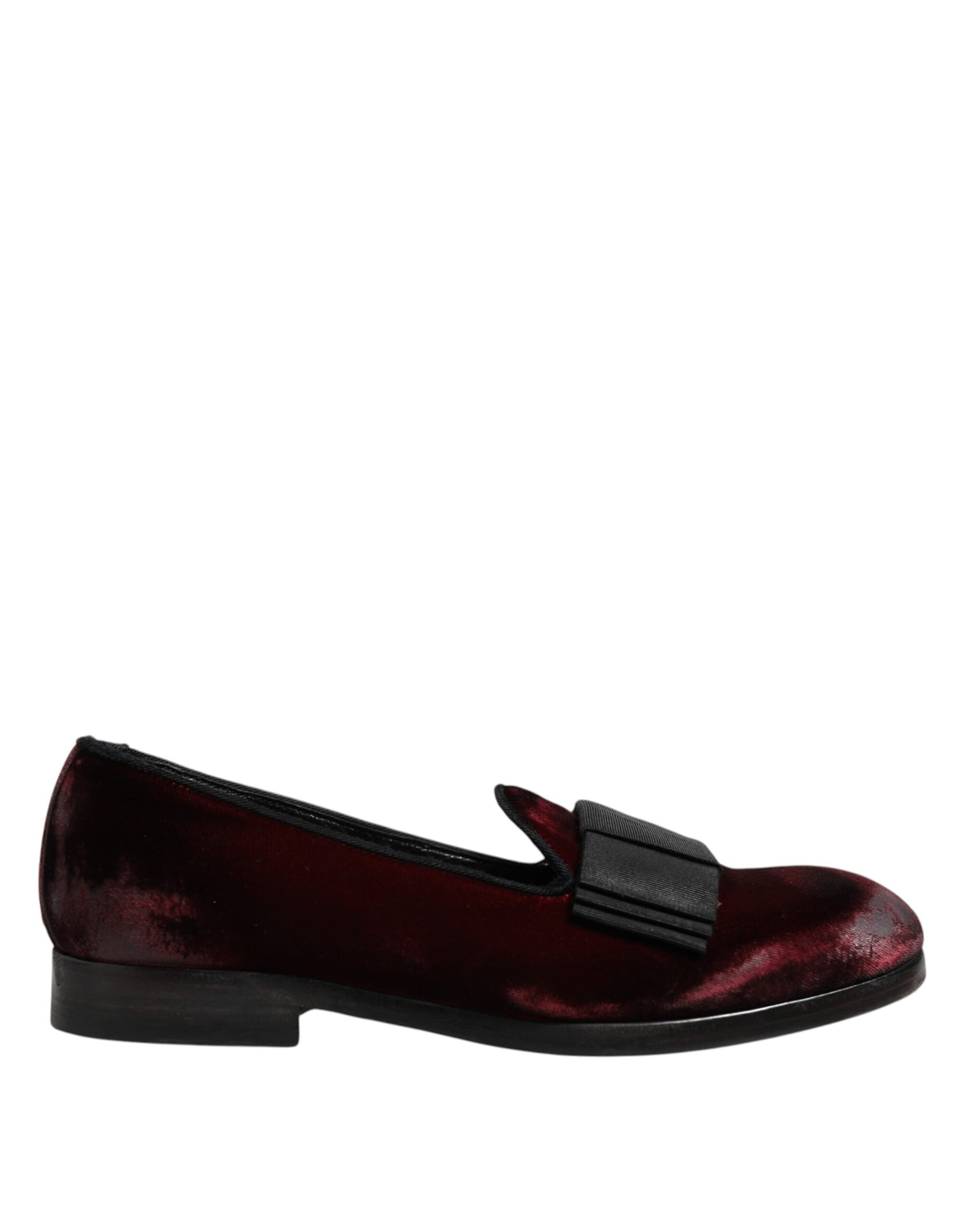 A pair of red velvet men's slip-on loafers with a black strap
