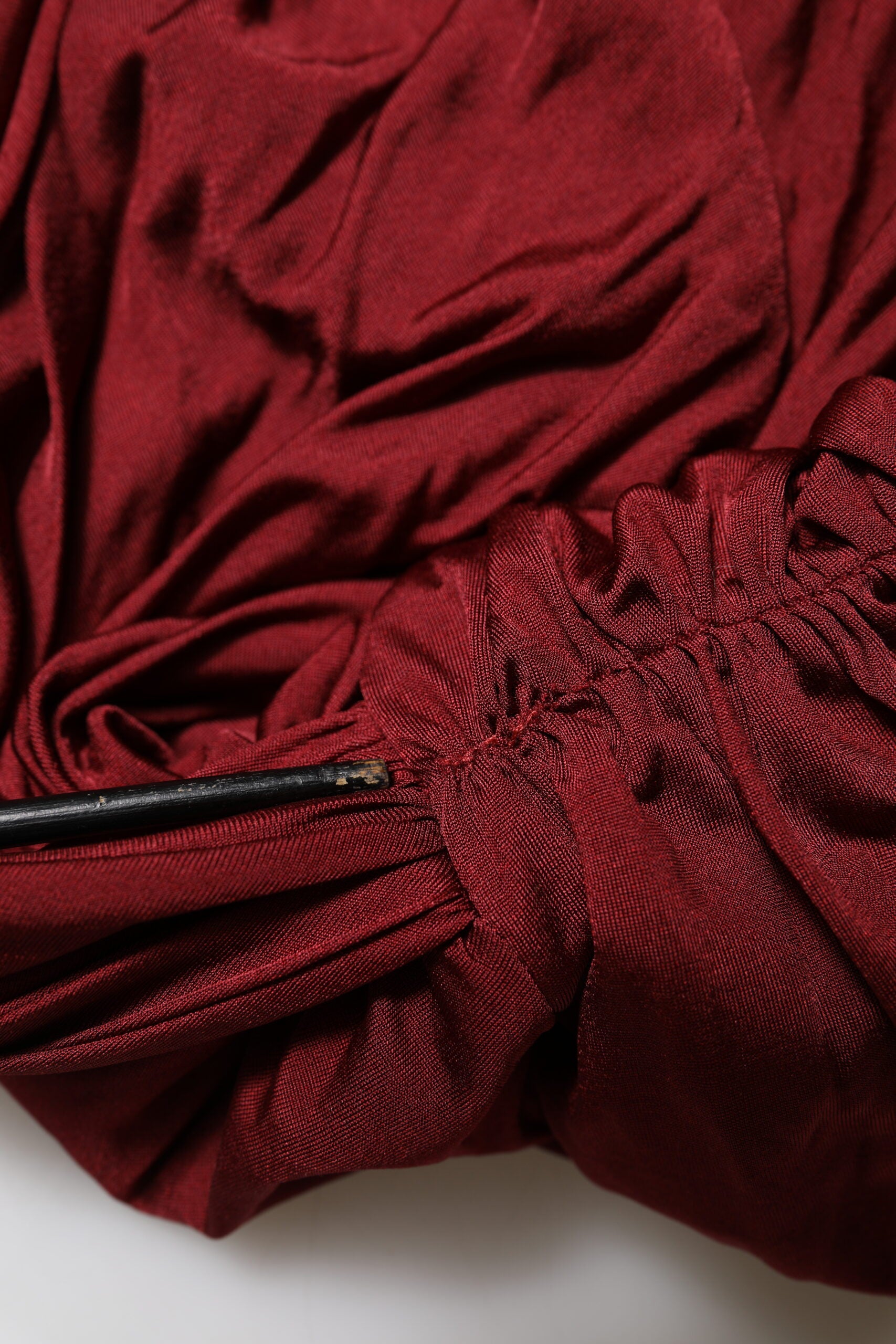 Red umbrella with black handle