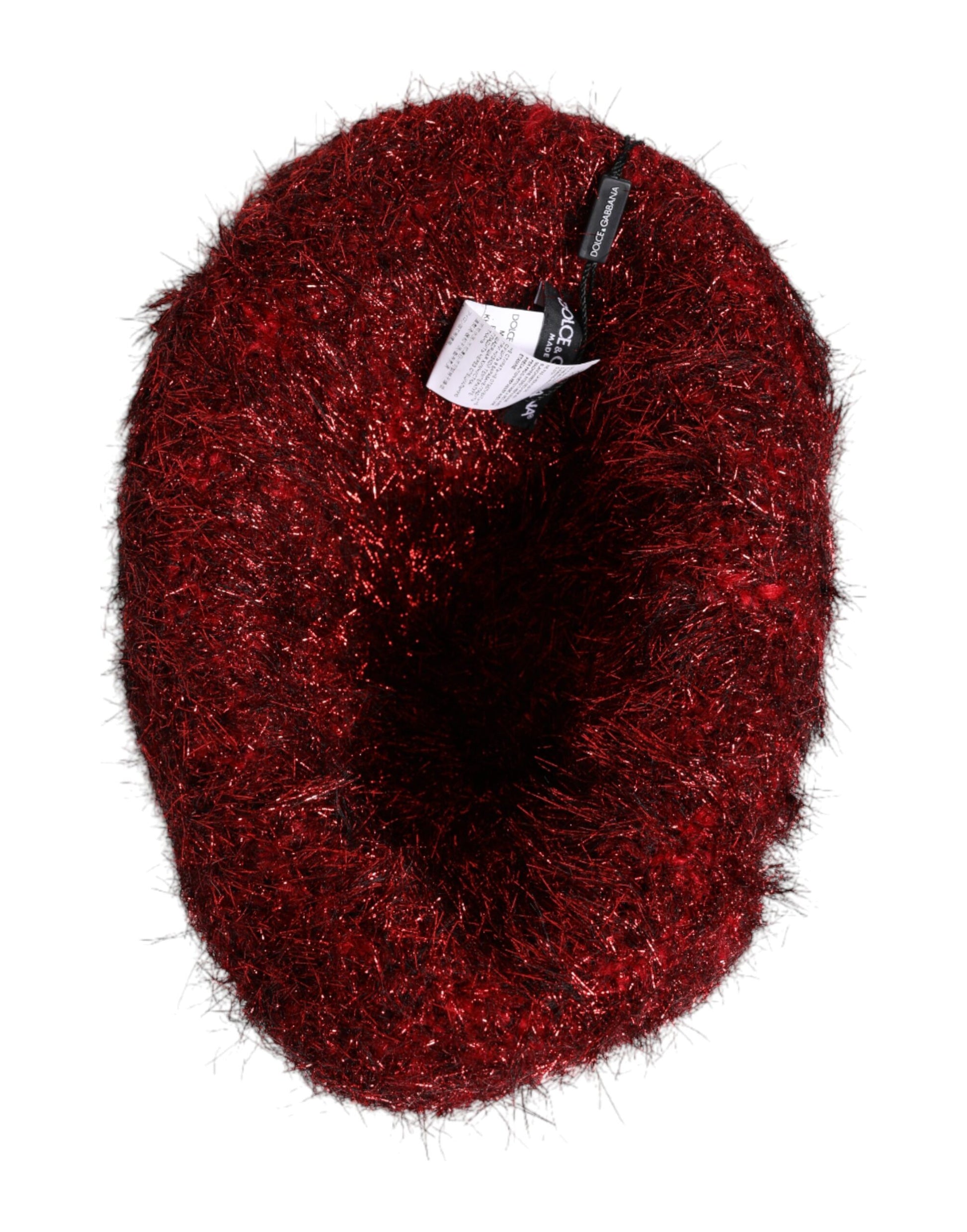 Red fuzzy hat with tag