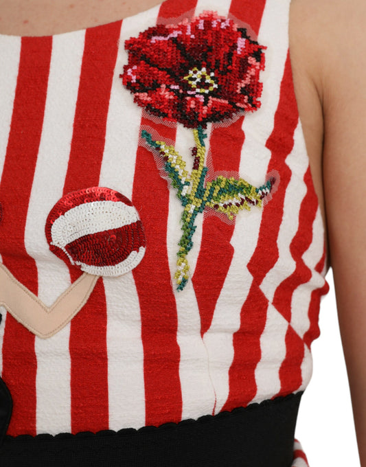 A red and white floral sleeveless midi dress with a flower embroidery on the chest