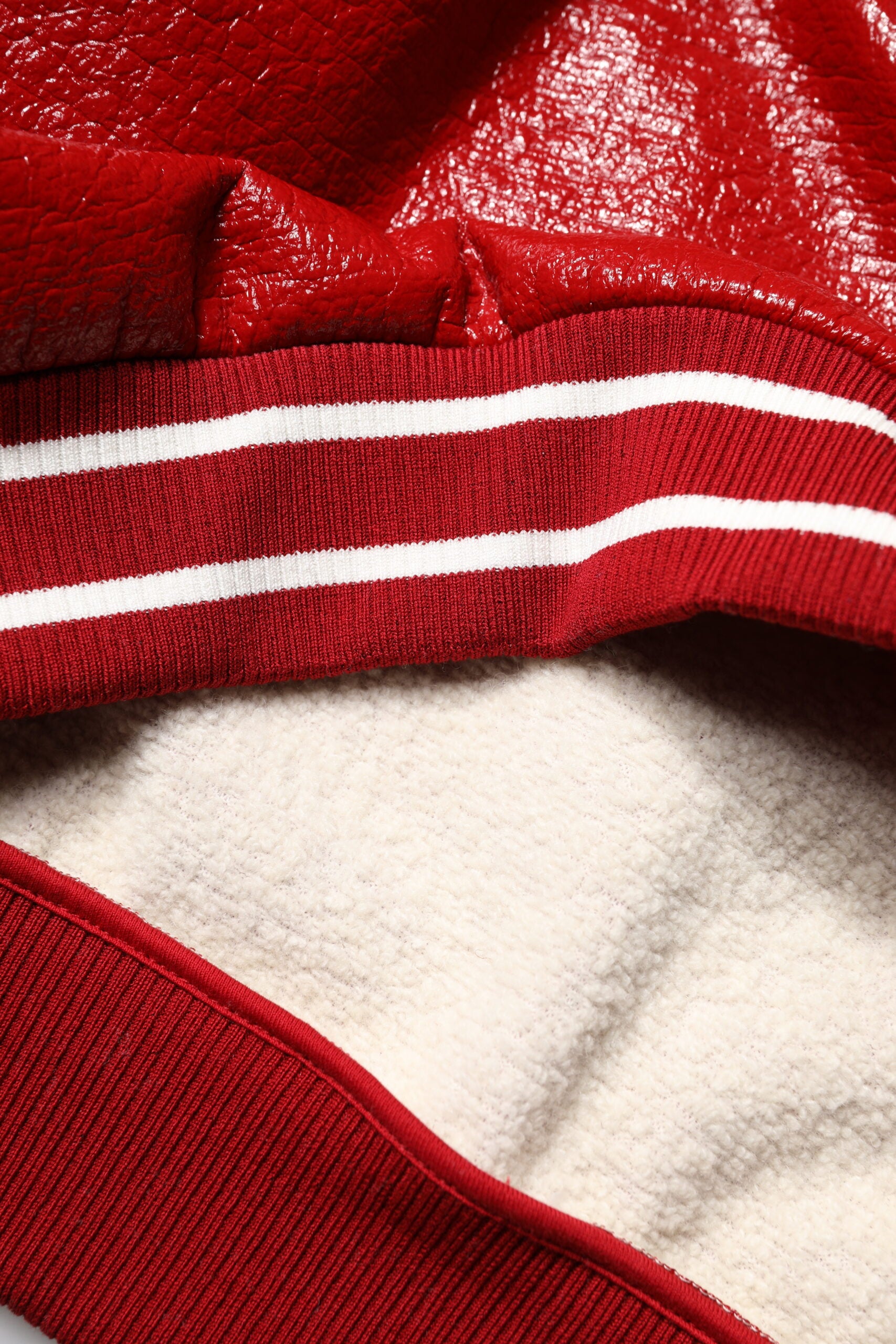 Red jacket with white stripes on sleeves