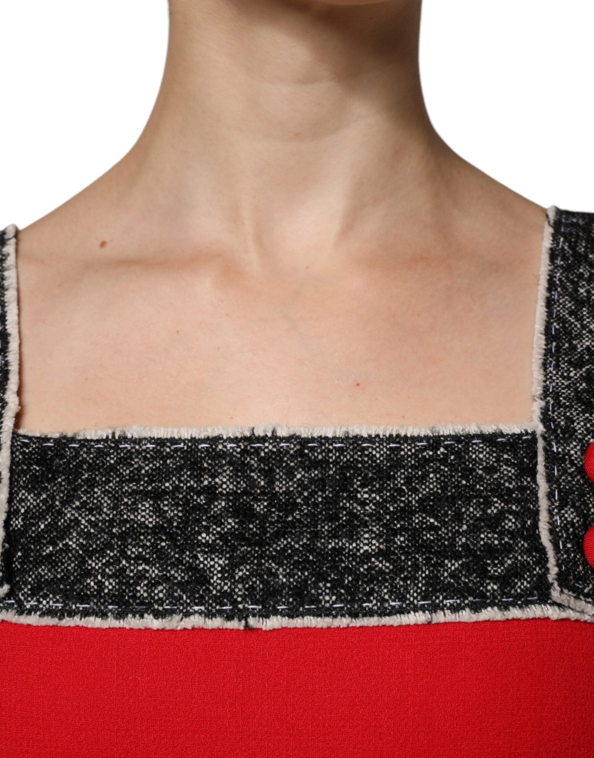 A red wool flared mini dress with black and white checkered pattern on the bodice
