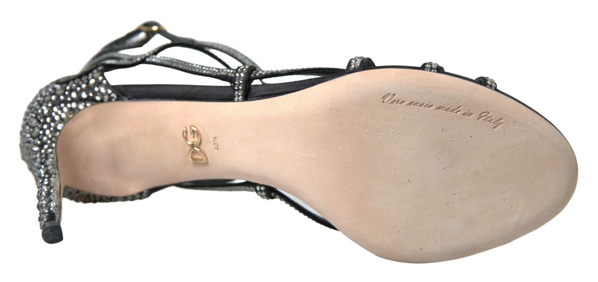 Footwear with a strap over the top of the foot and a bow on the side