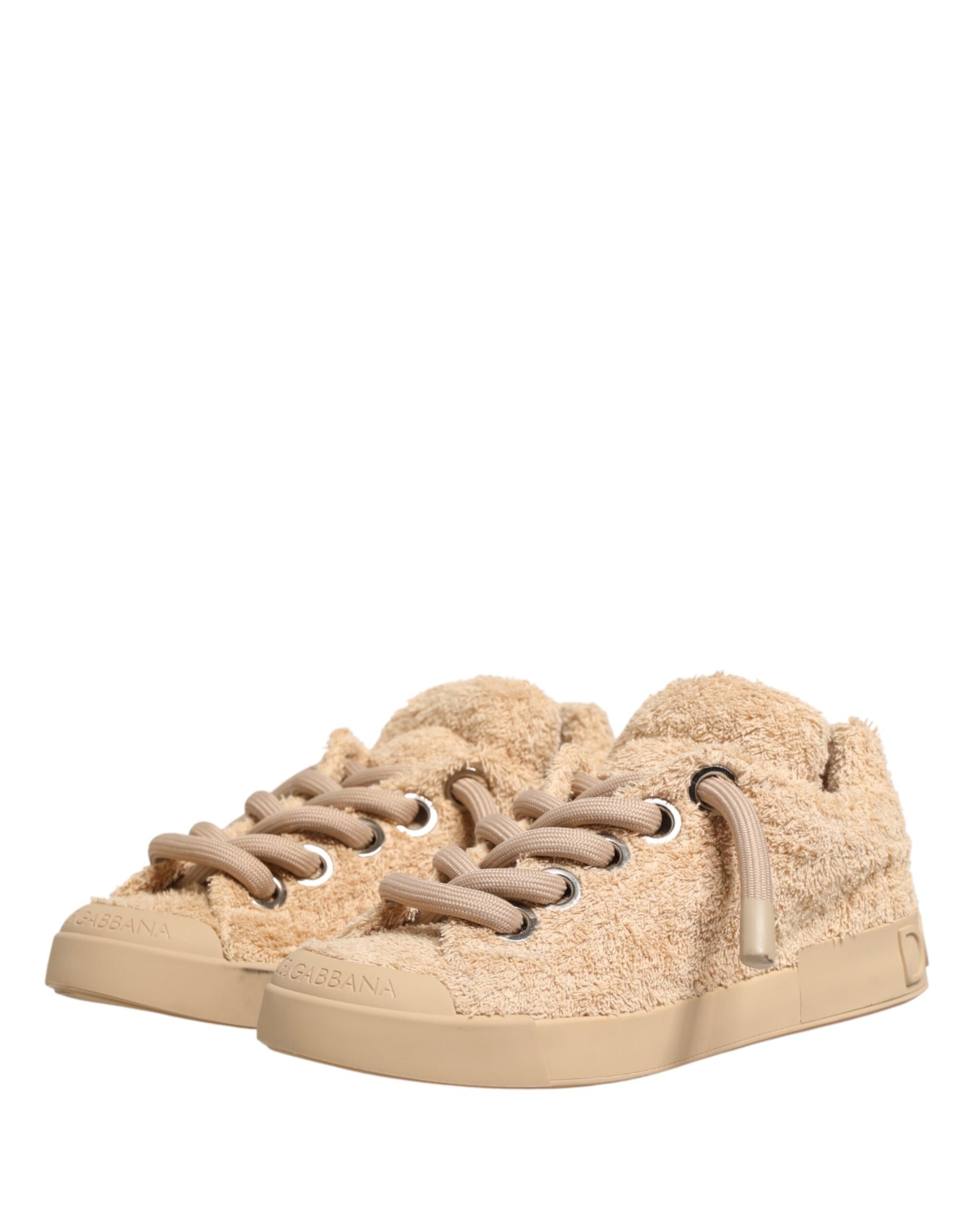 Tan faux shearling low top sneakers with laces and a flat sole