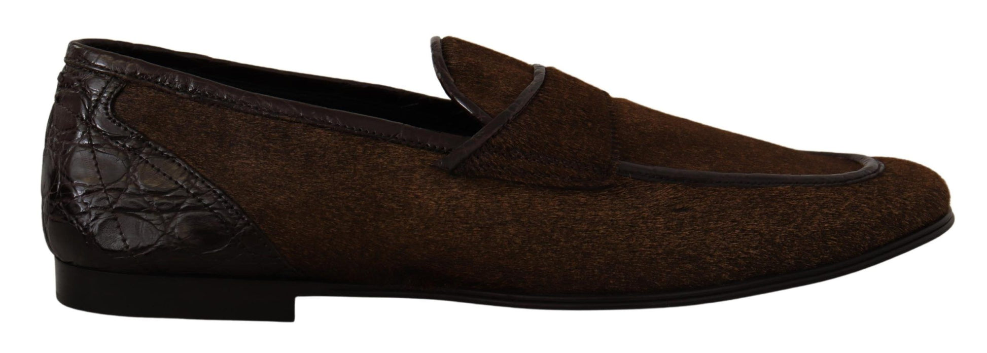 Pair of brown loafers with a bow on top