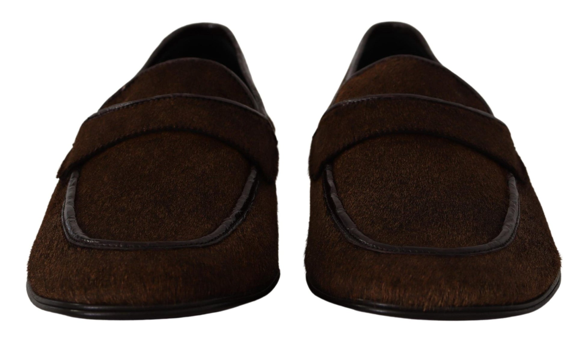 Pair of brown slippers with black trim and soles