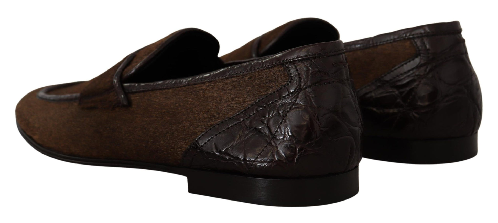 Pair of brown leather shoes with laces and a strap across the top