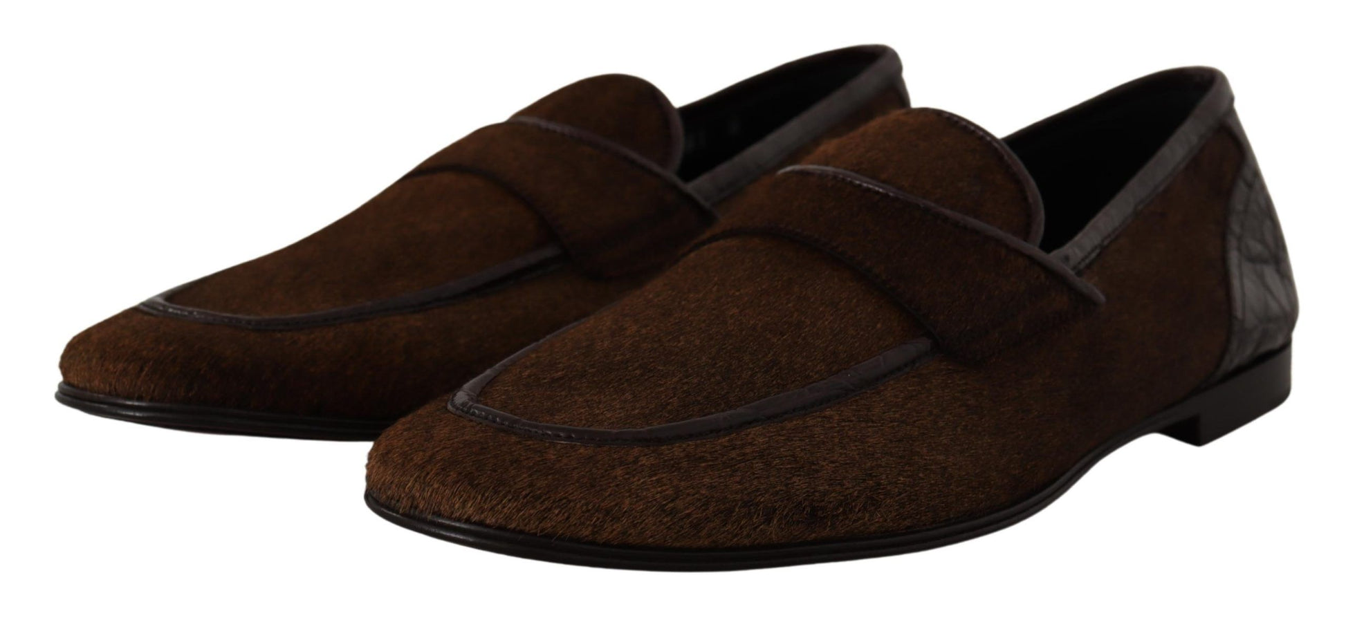 Pair of brown loafers with a strap across the top
