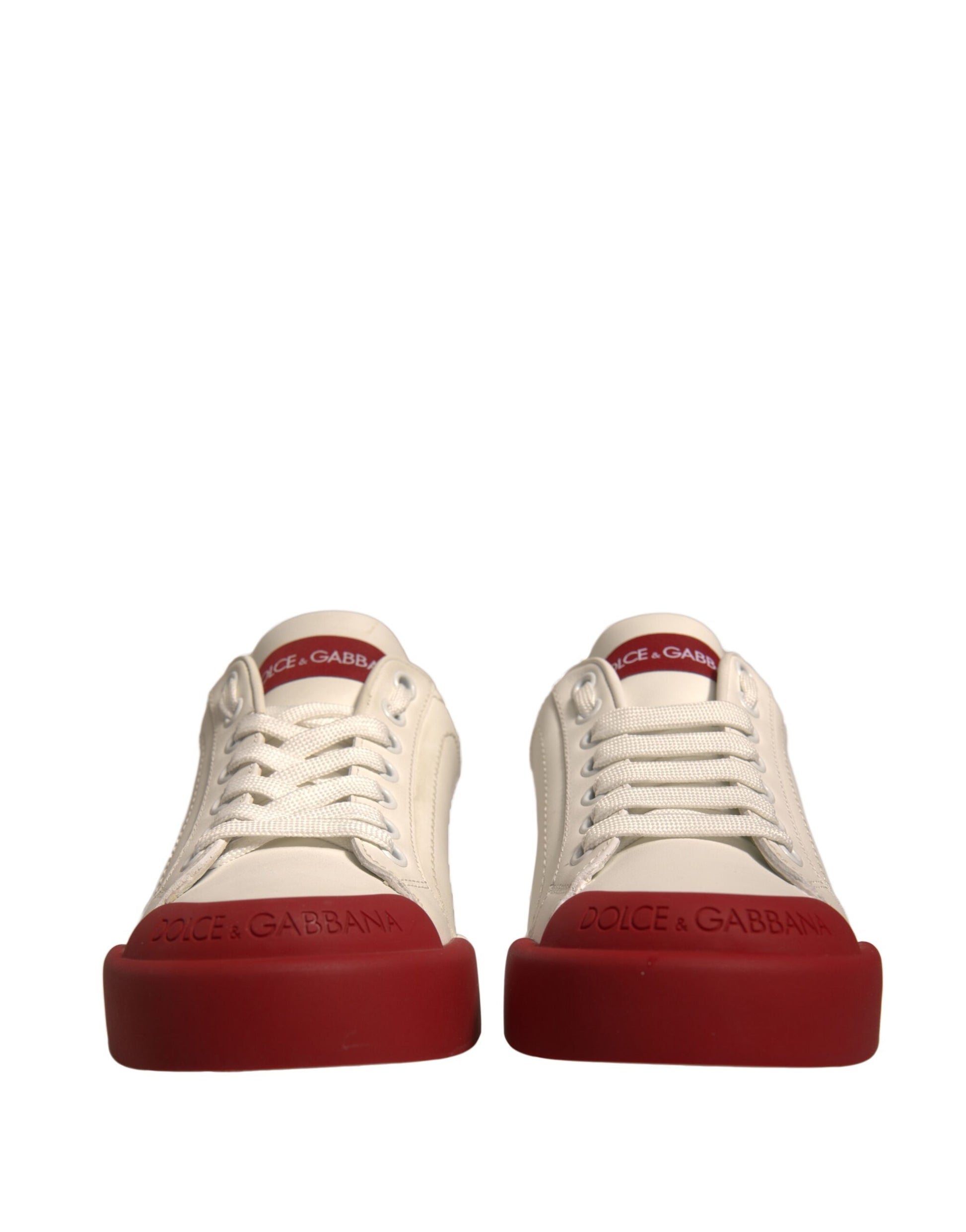 Pair of white sneakers with red soles
