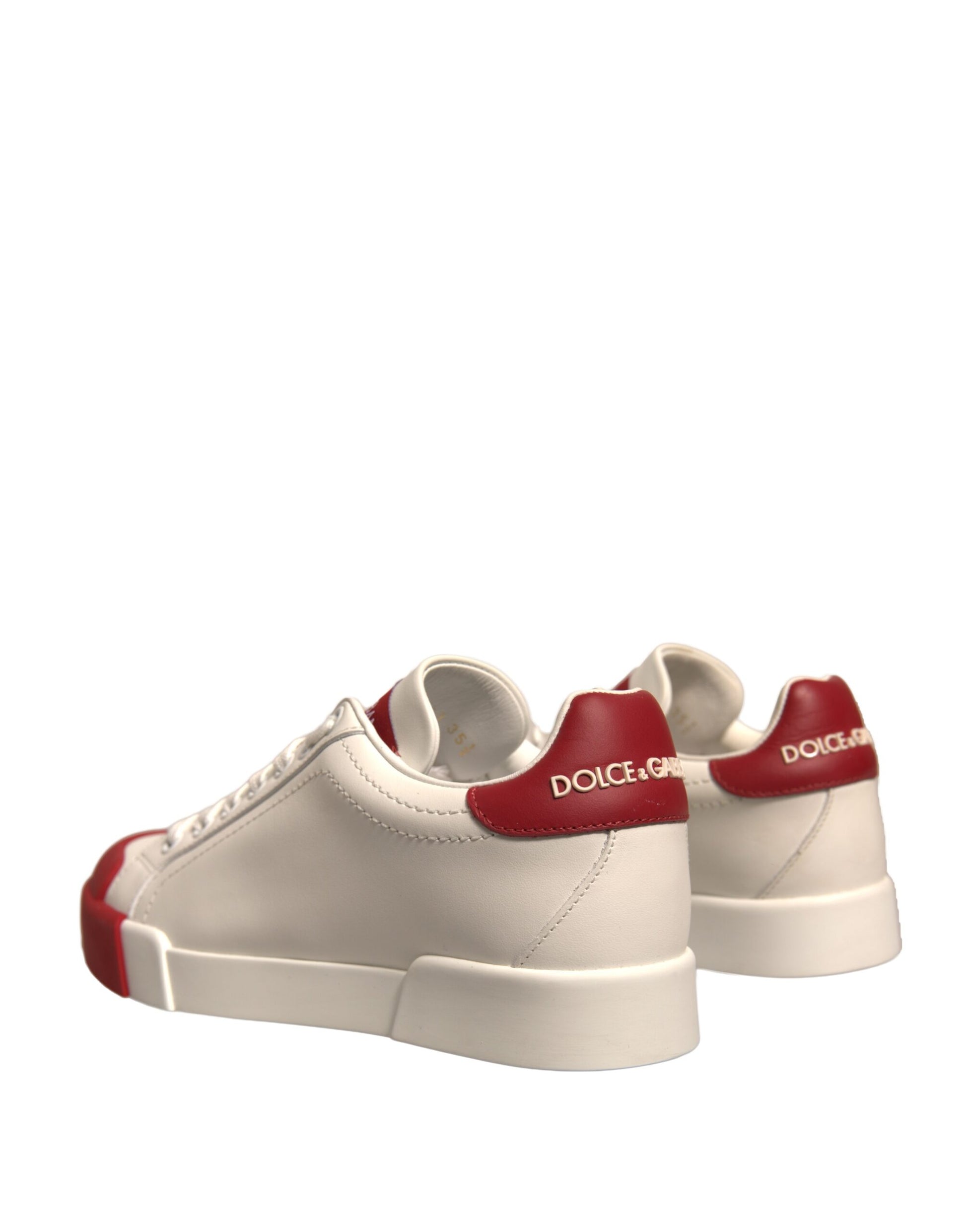 Pair of white sneakers with red accents