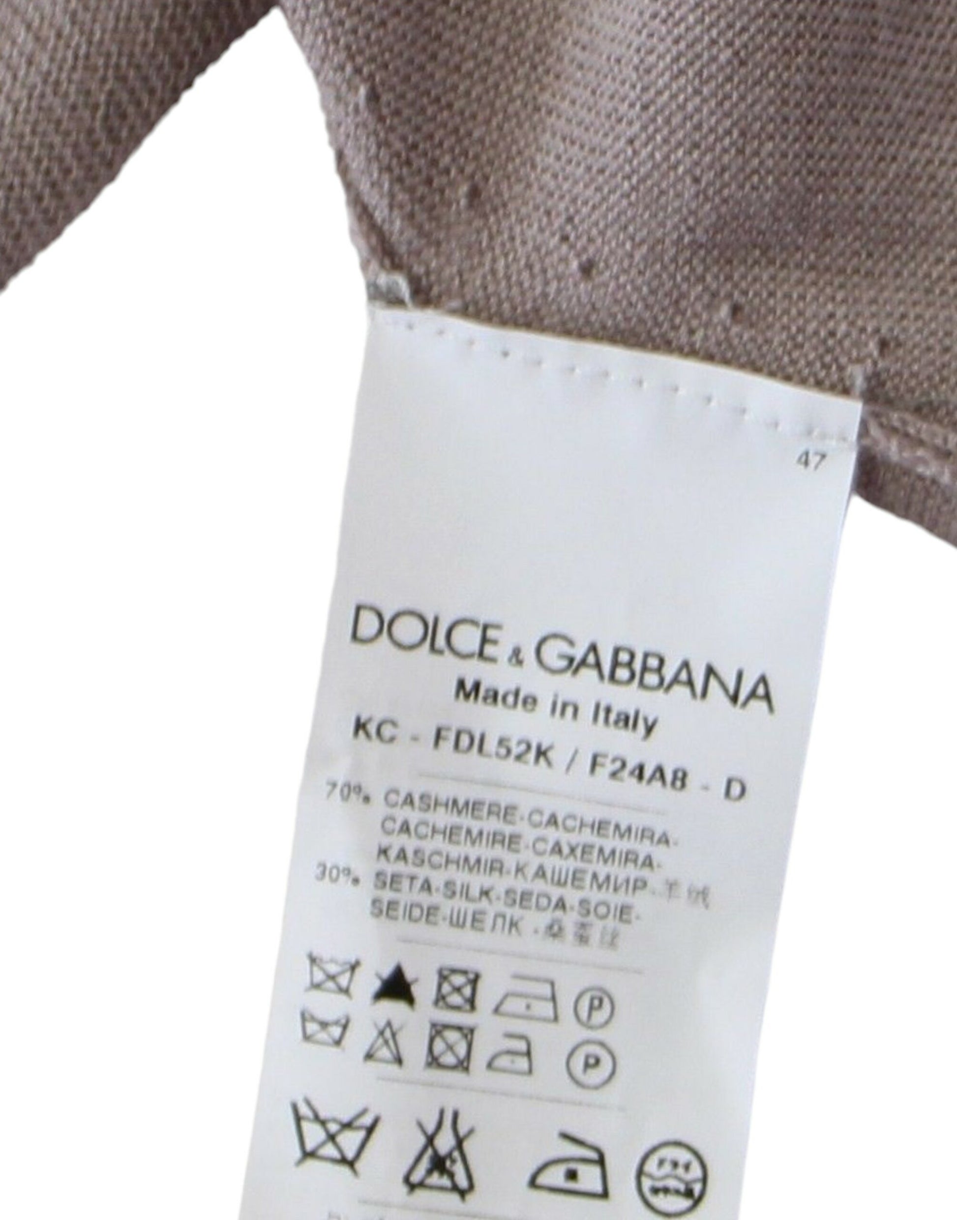 Tag on garment indicating brand and country of manufacture