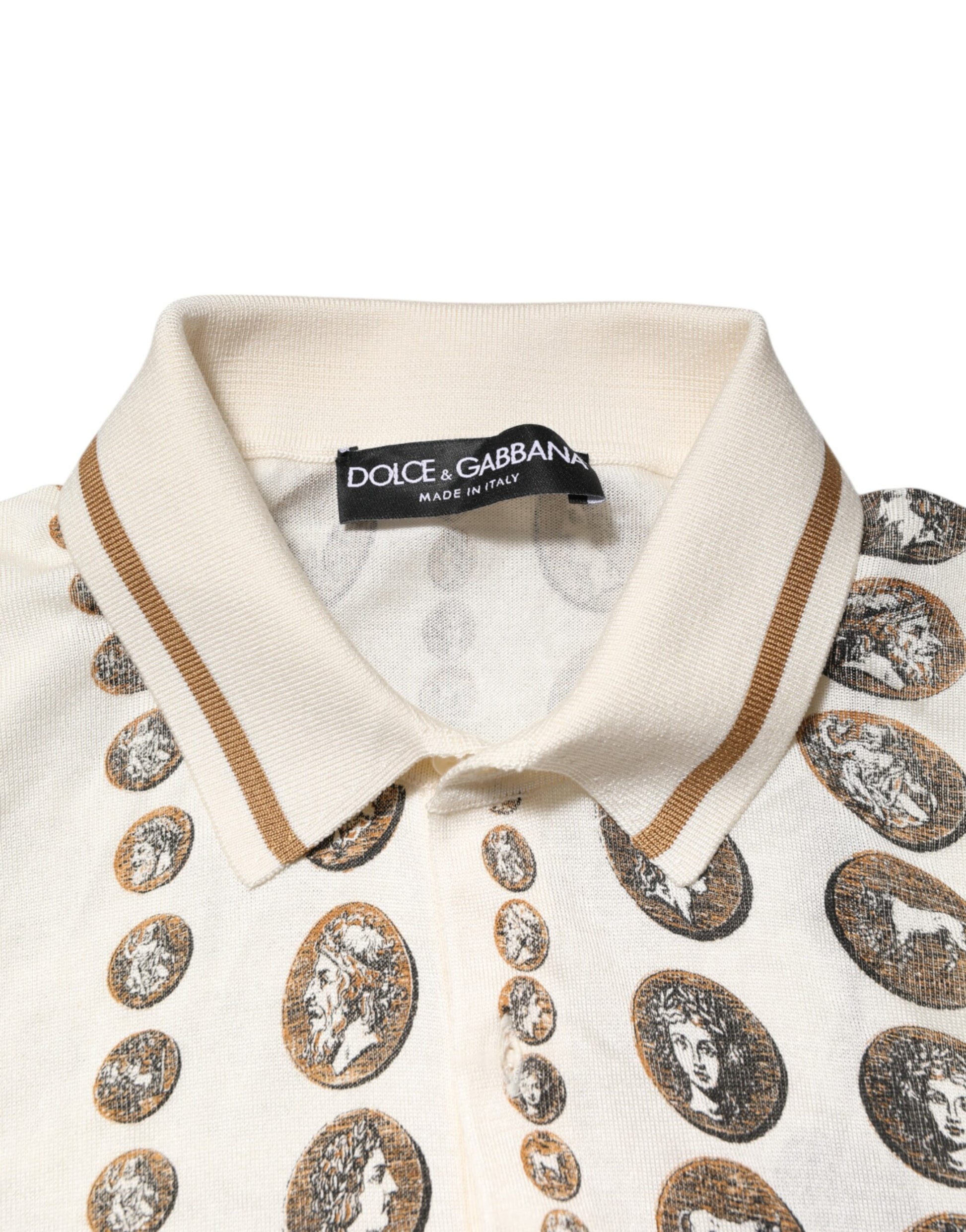 Tan shirt with brown collar and cuffs, featuring a pattern of coins on front