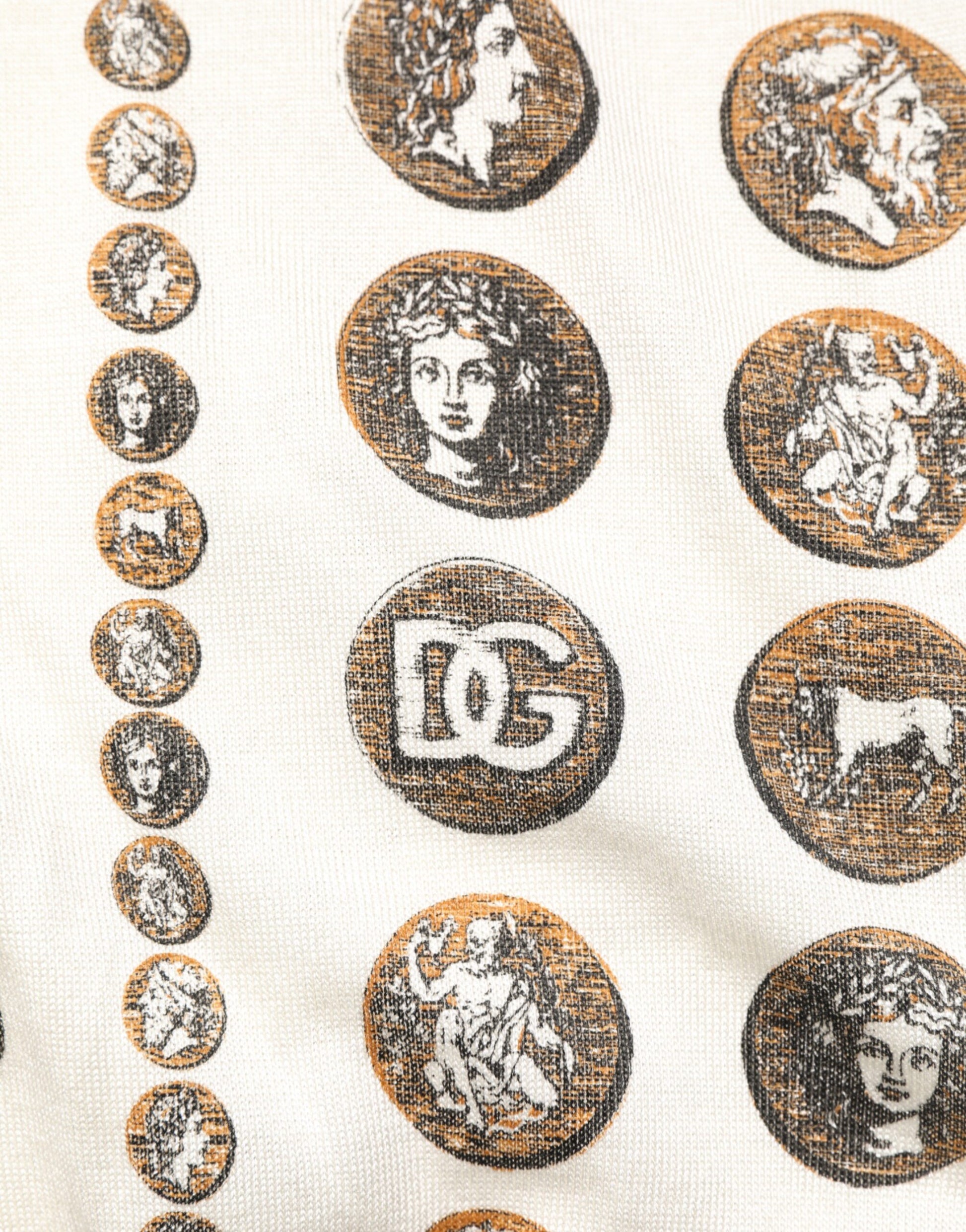 Decorative fabric with circular embroidered designs featuring classical figures