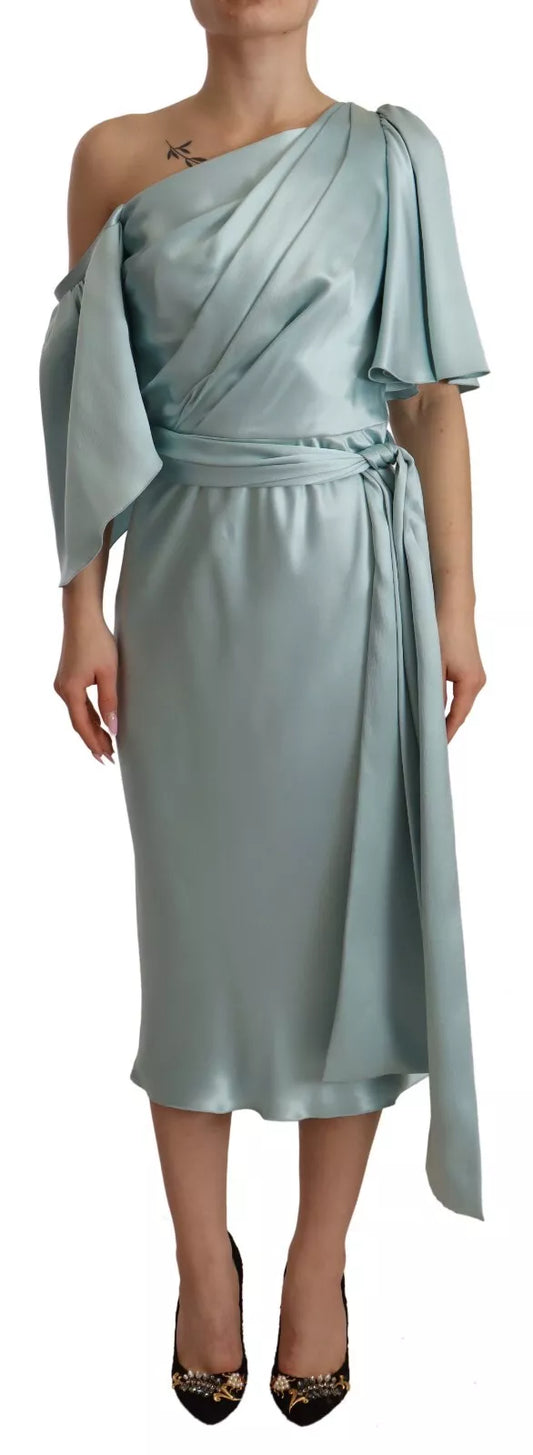 Woman wearing a long blue dress with ruffles on sleeves