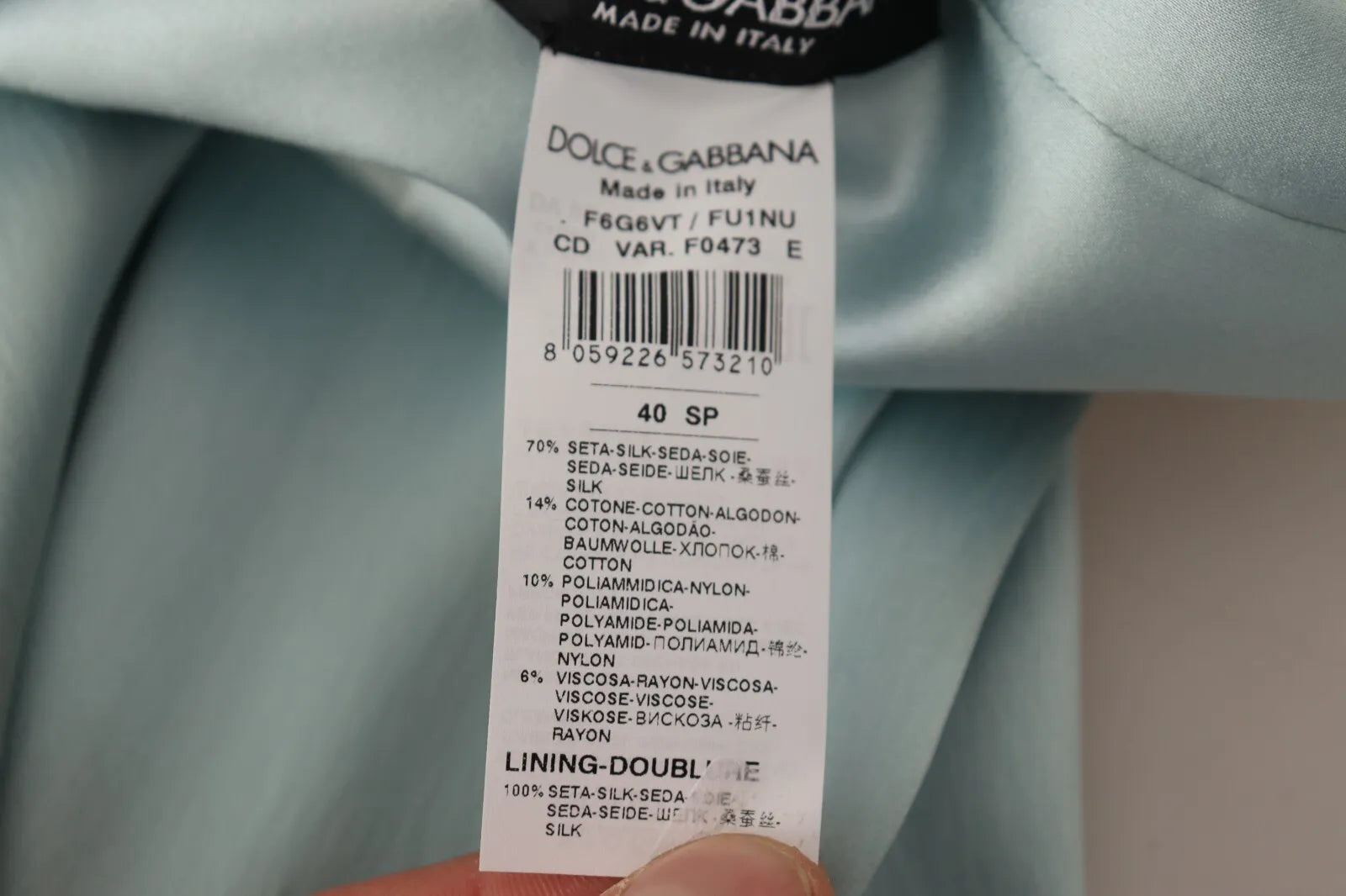 Tag on garment indicating brand and size