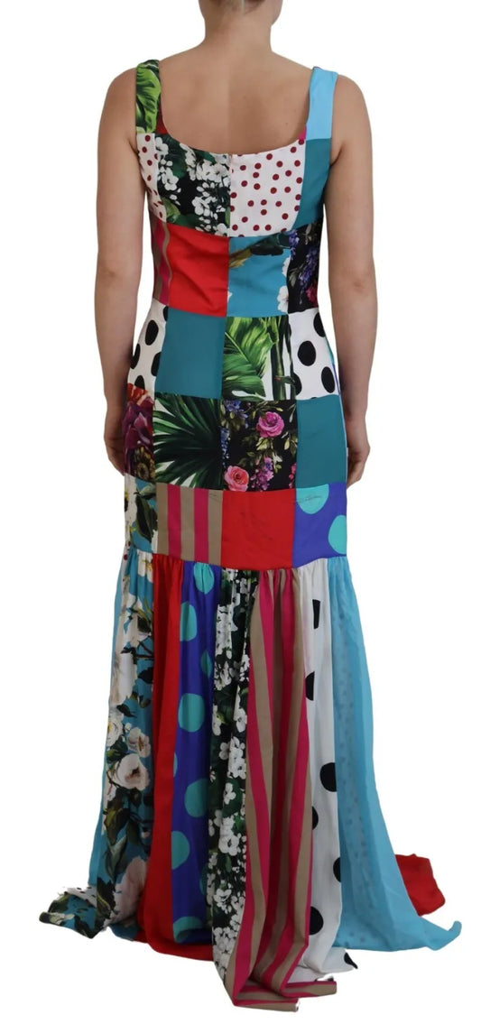 A colorful patchwork maxi dress with a sheath silhouette, featuring a mix of floral and geometric patterns in various colors
