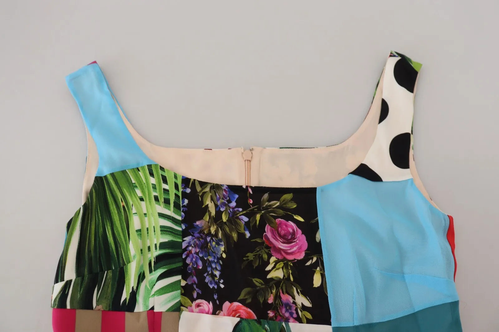 A colorful patchwork dress with floral and tropical prints, designed by Dolce & Gabbana