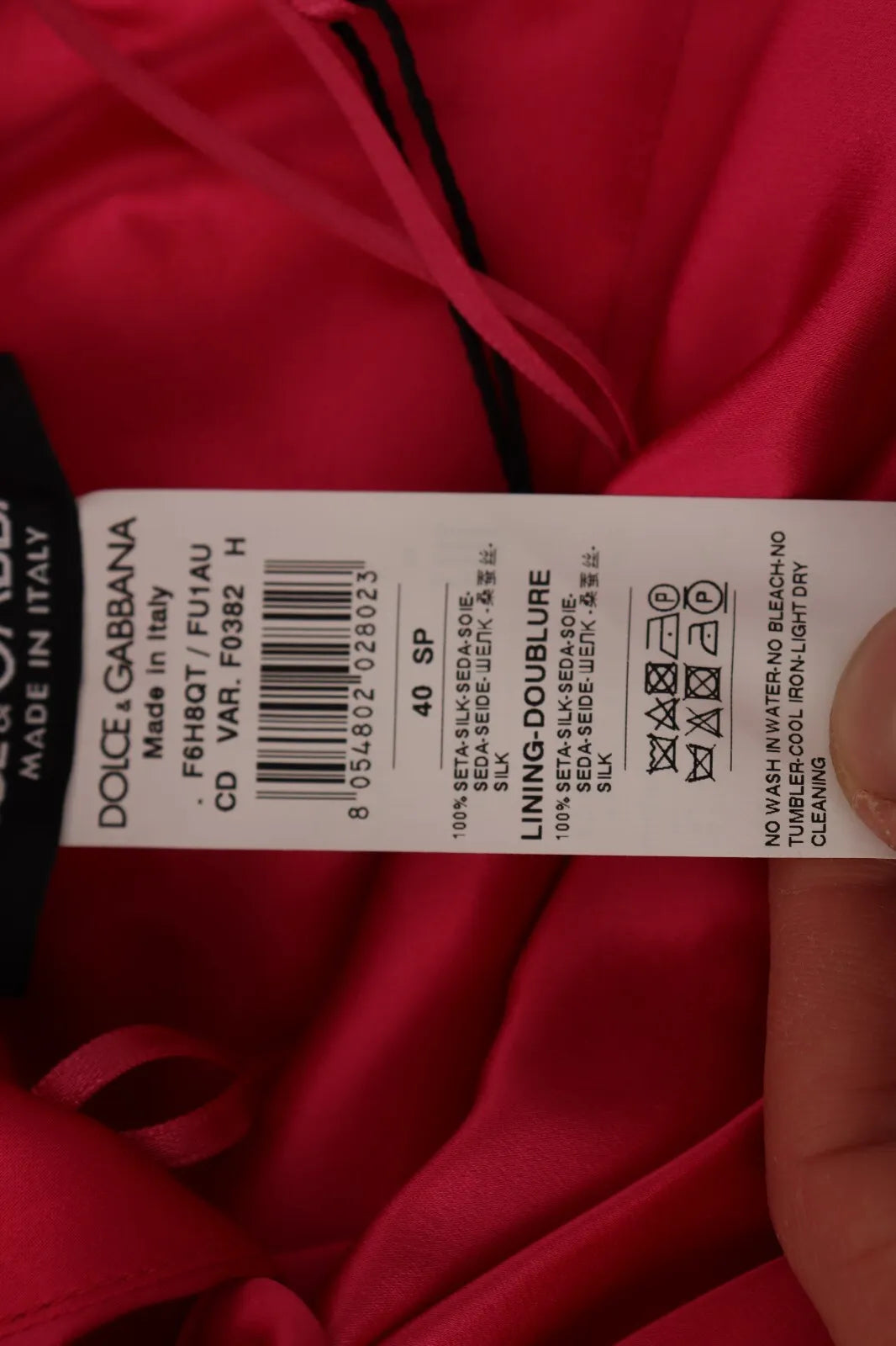 Tag on red fabric
