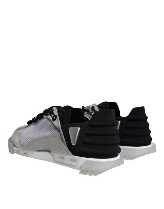 A pair of black and silver sneakers with nylon material, featuring a low top design