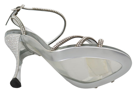Silver high heel shoe with rhinestones and a strap over the toe