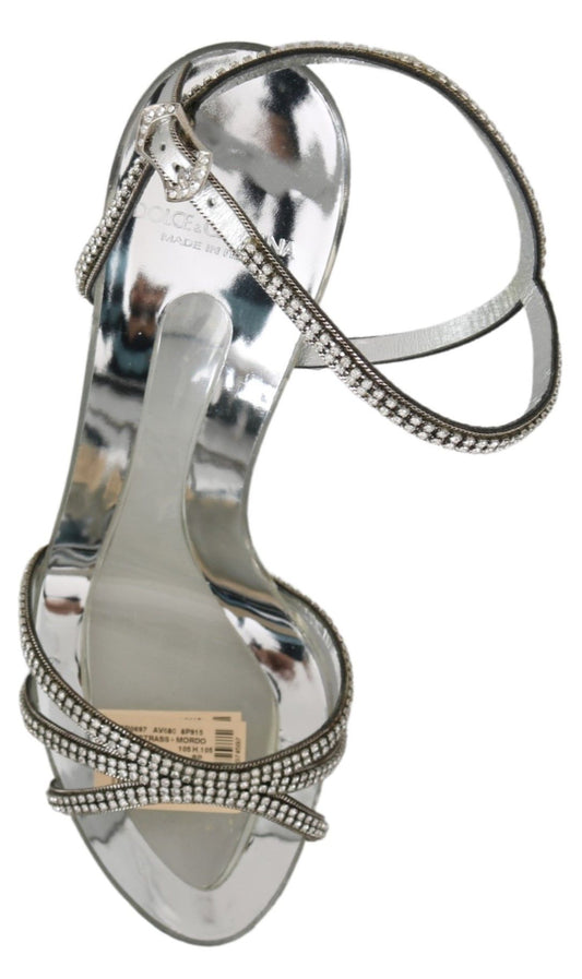 Silver high heel shoe with rhinestones and a strap over the foot