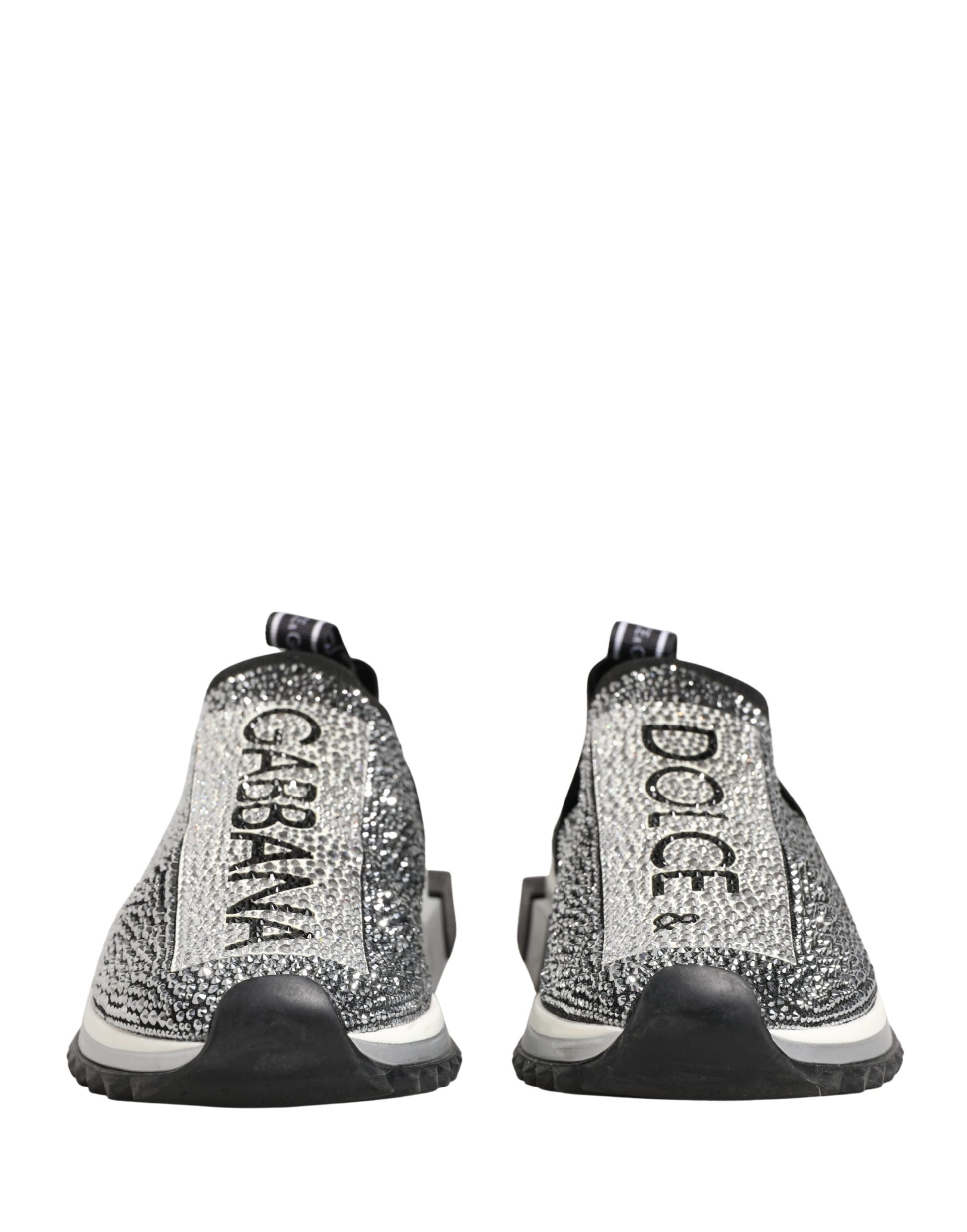 Pair of silver crystal logo slip on shoes by Dolce & Gabbana