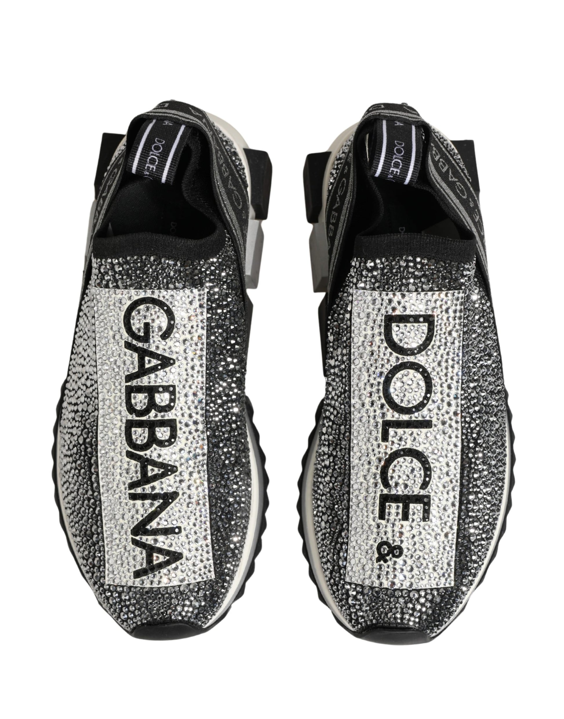 Pair of silver crystal logo slip on shoes with black laces