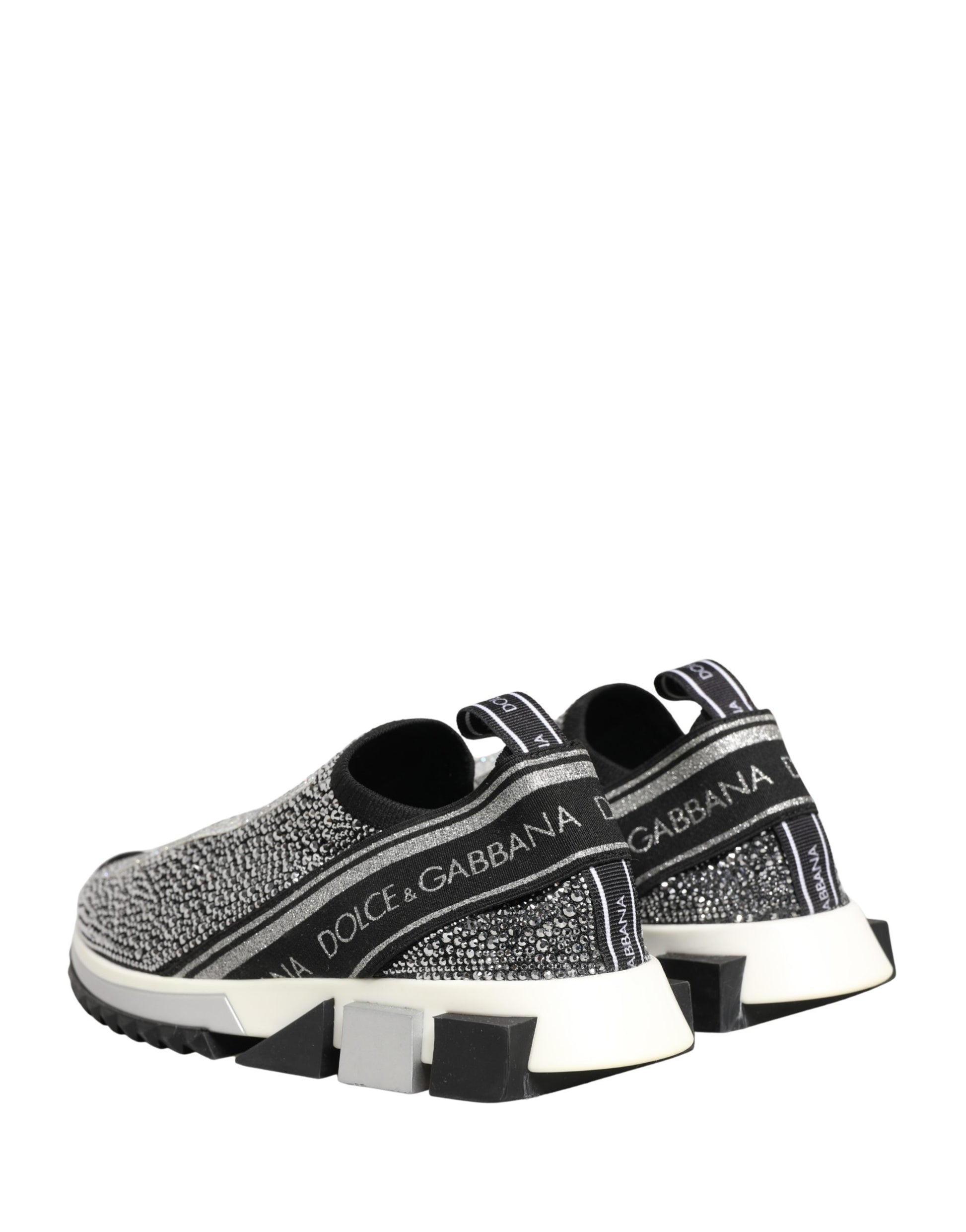 Pair of slip-on shoes with silver crystal logo and black laces
