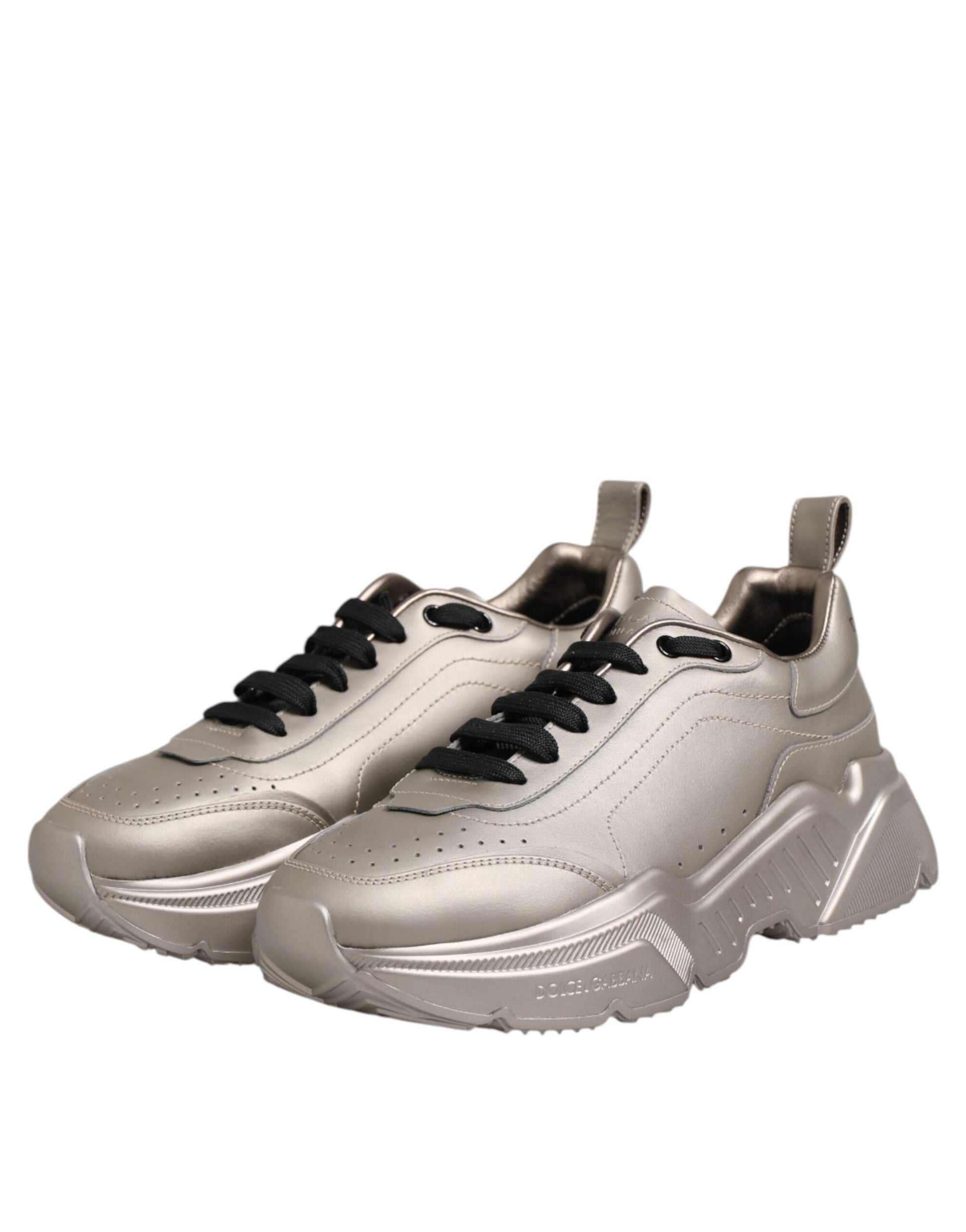 Pair of silver sneakers with black laces
