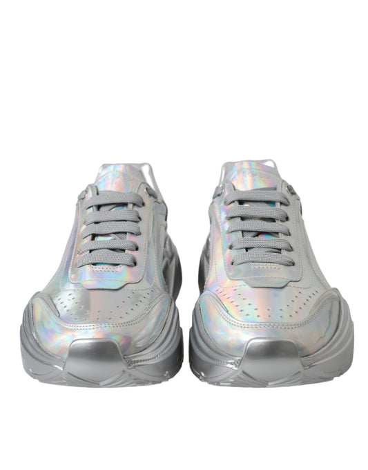 Pair of silver sneakers with reflective material on side panels and laces