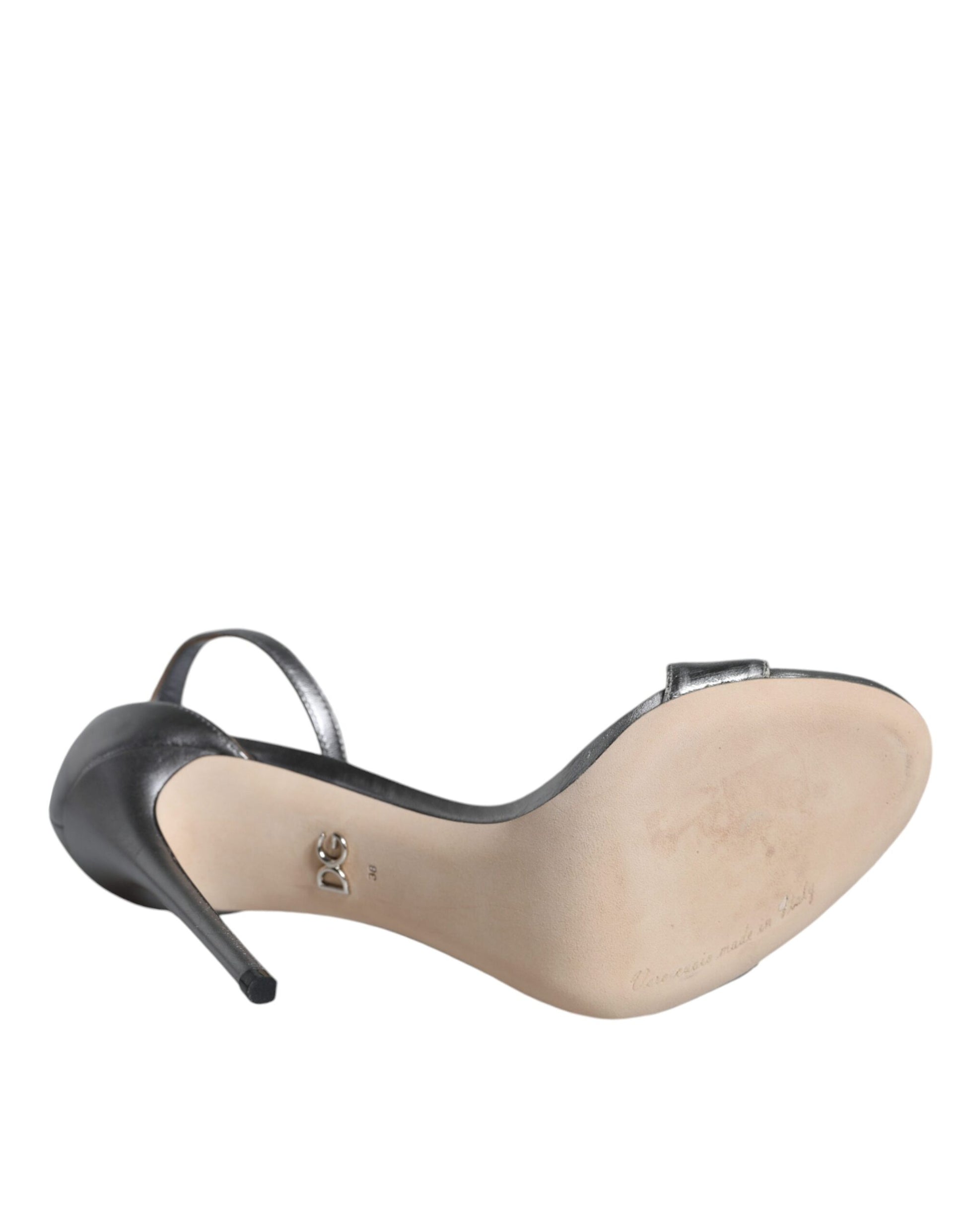 Black high heel shoe with tan insole