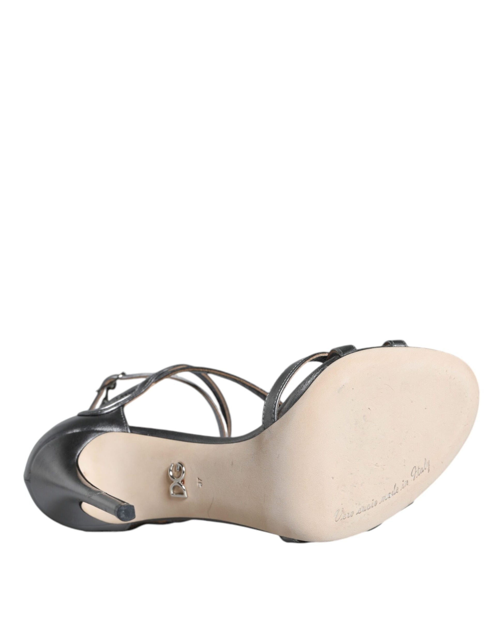 Black high heel shoe with tan toe cap