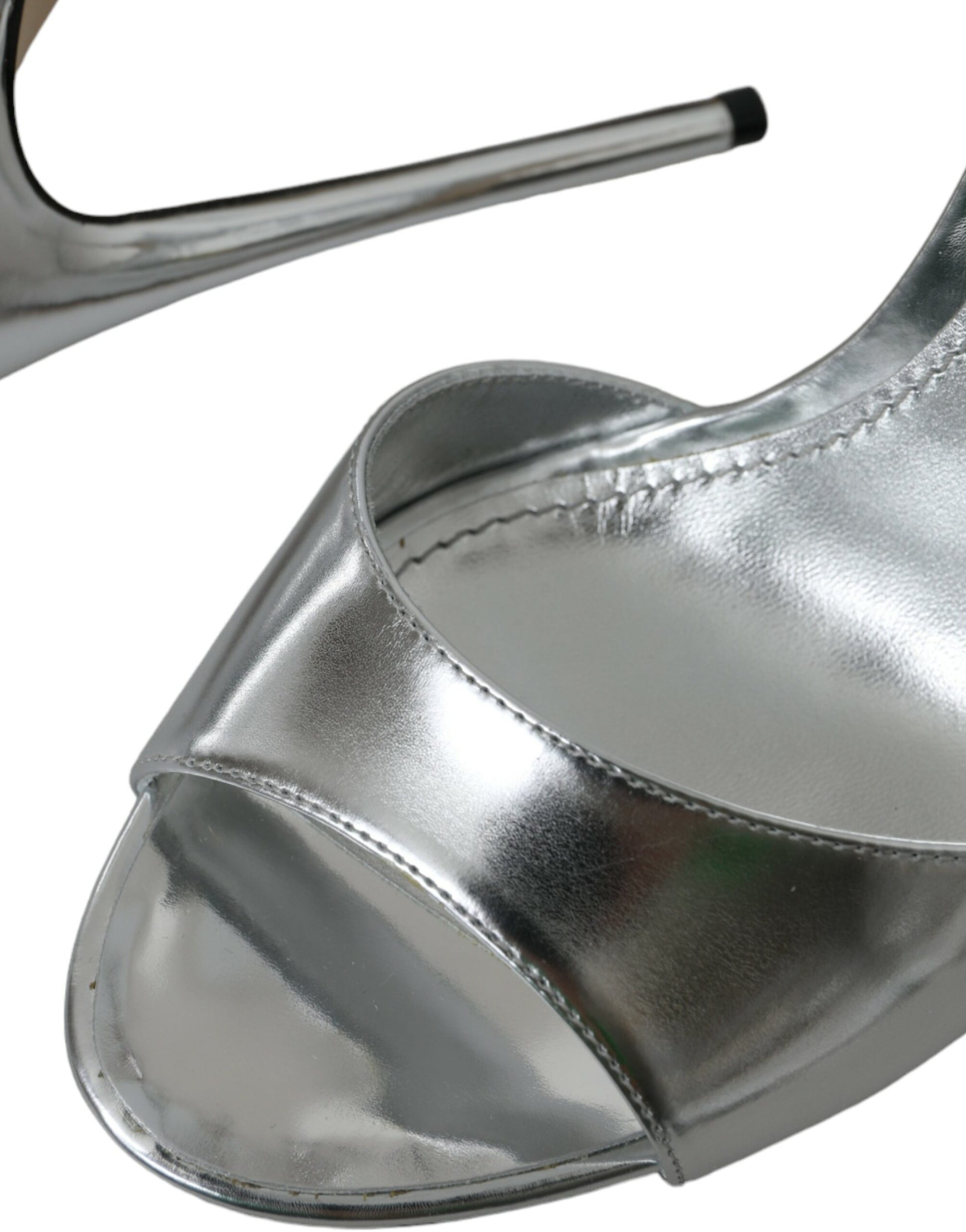 Silver high heel shoe with stiletto heel and pointed toe