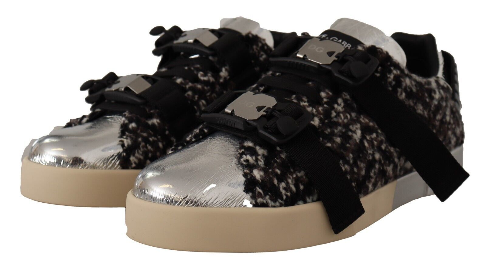 Pair of children's sneakers with glittery silver and black fabric upper, white soles, and laces
