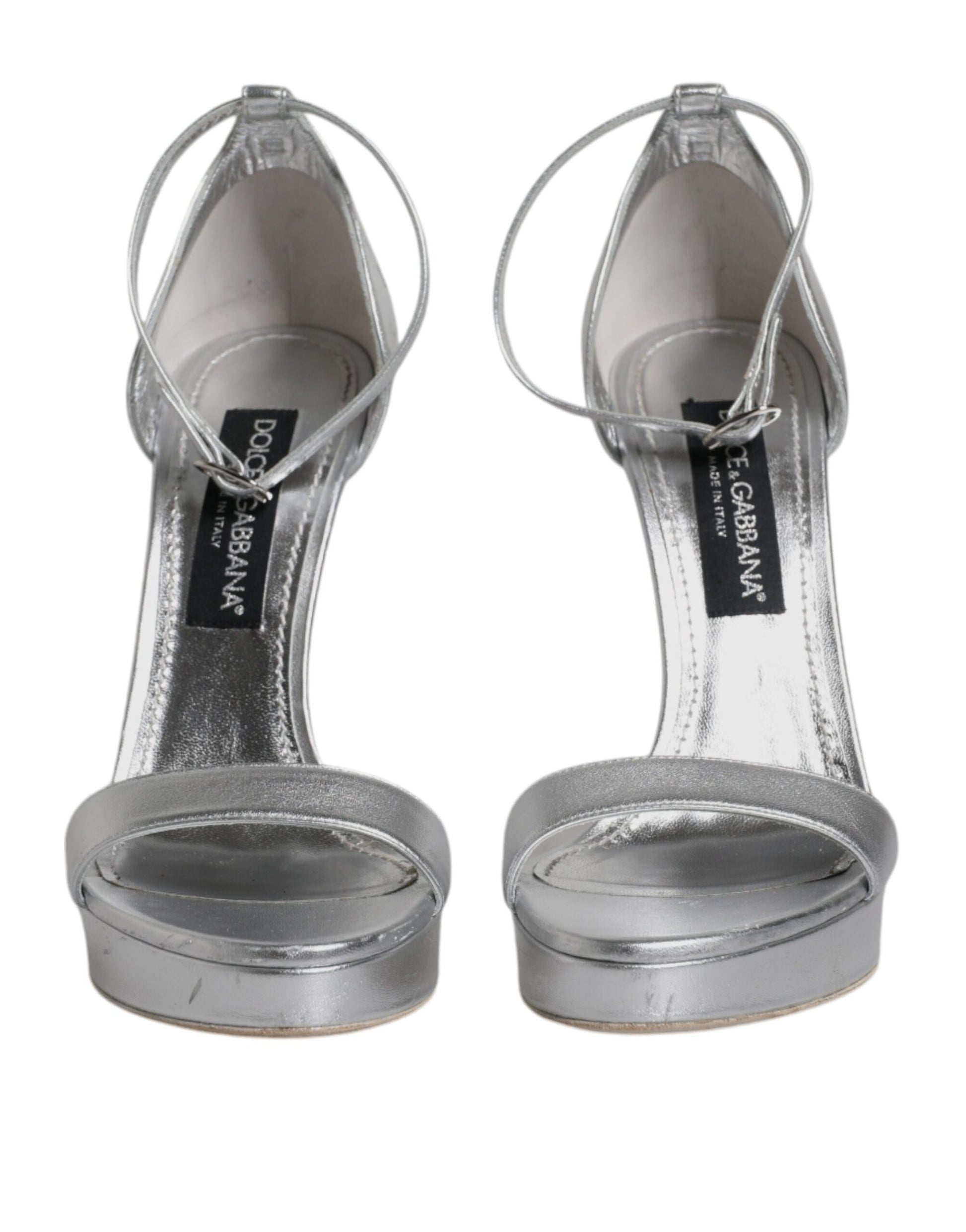 Silver high heel shoes with straps