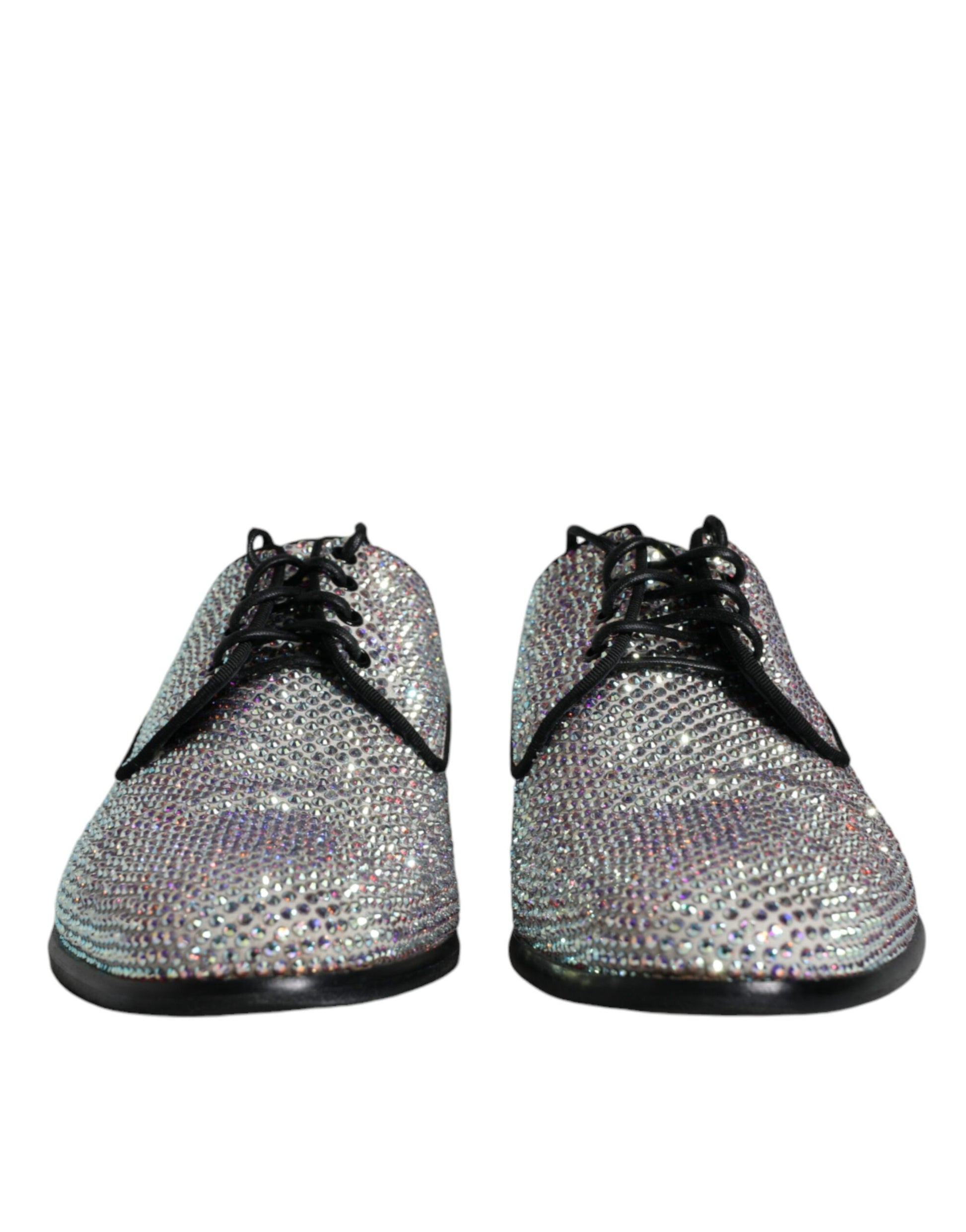 Pair of glittery silver leather shoes with rhinestone embellishments