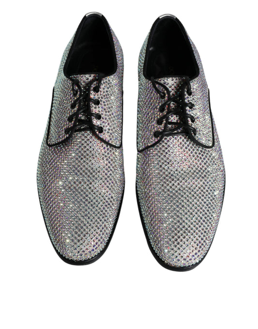 Pair of glittery silver leather dress shoes with rhinestone embellishments