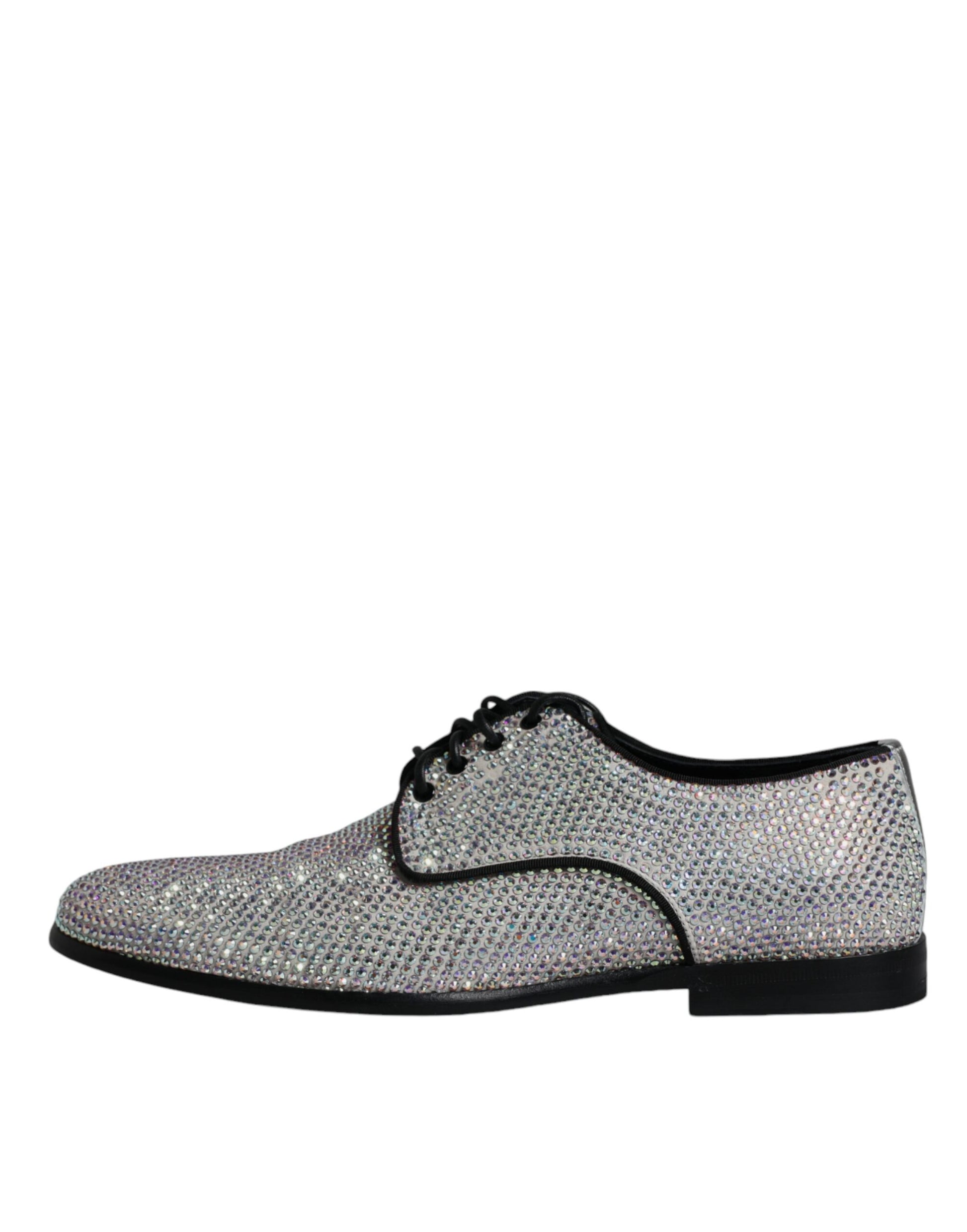 A pair of silver leather rhinestone dress shoes with black laces and soles