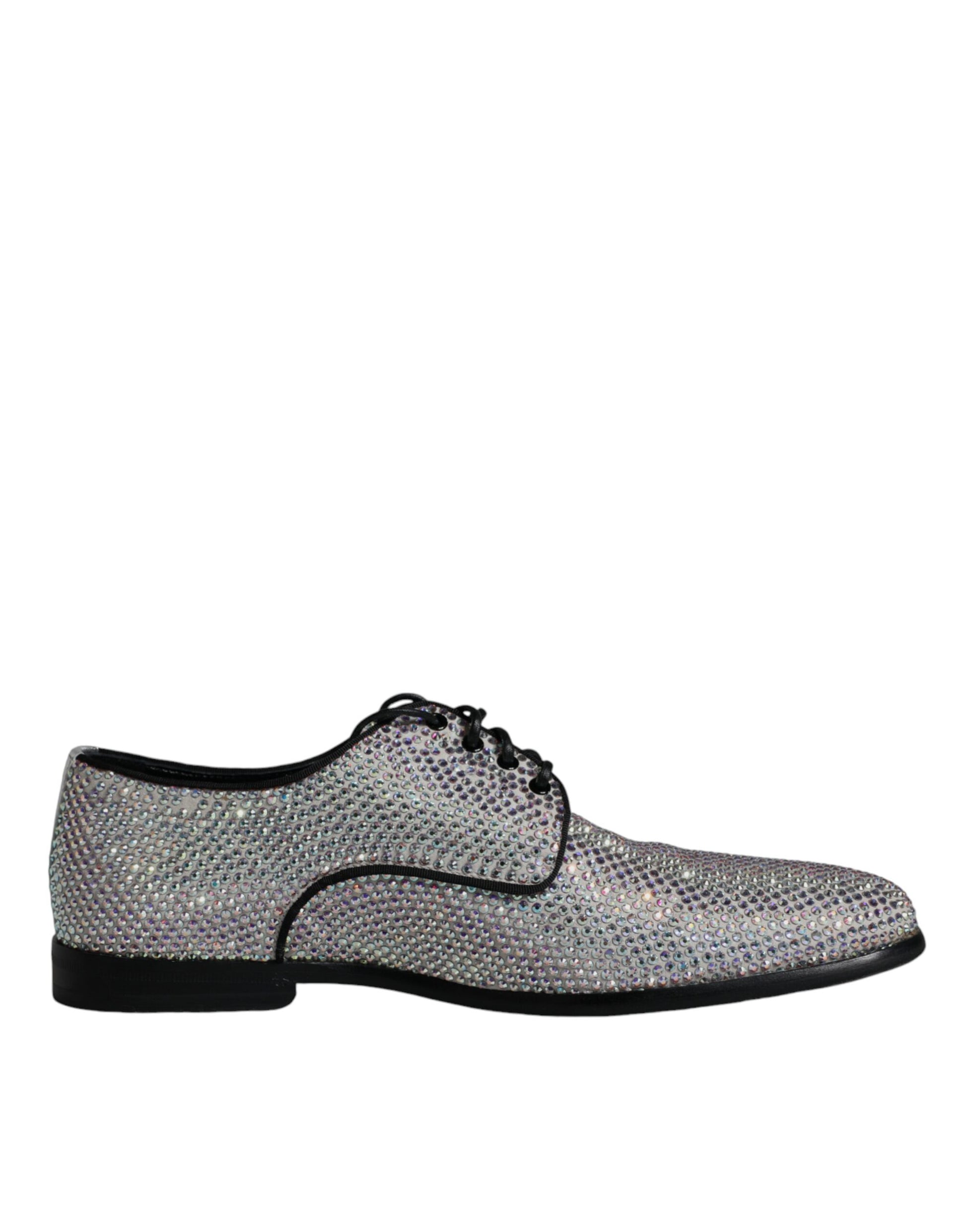 A pair of silver leather rhinestone dress shoes with black soles and laces