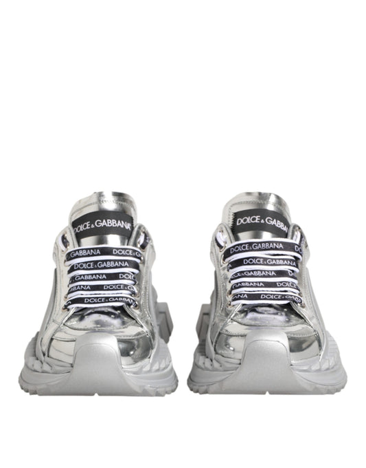 Pair of silver sneakers with black laces