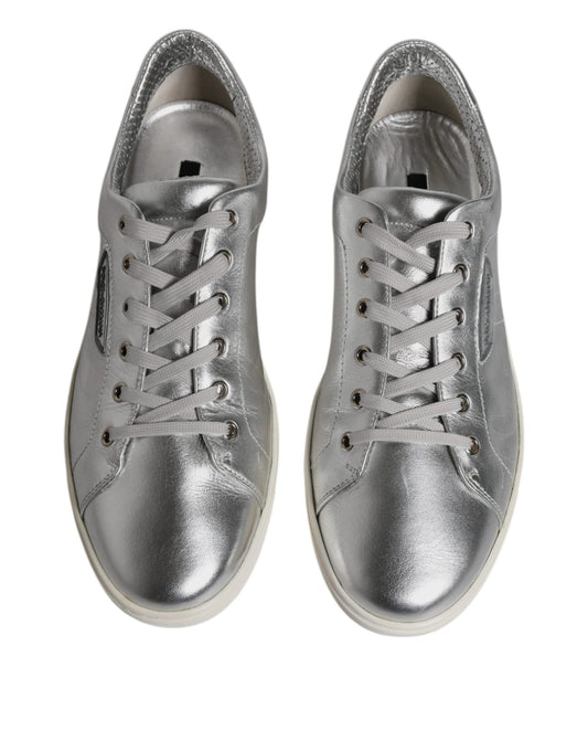 Pair of silver leather sneakers with laces and a low top, featuring the Dolce & Gabbana logo