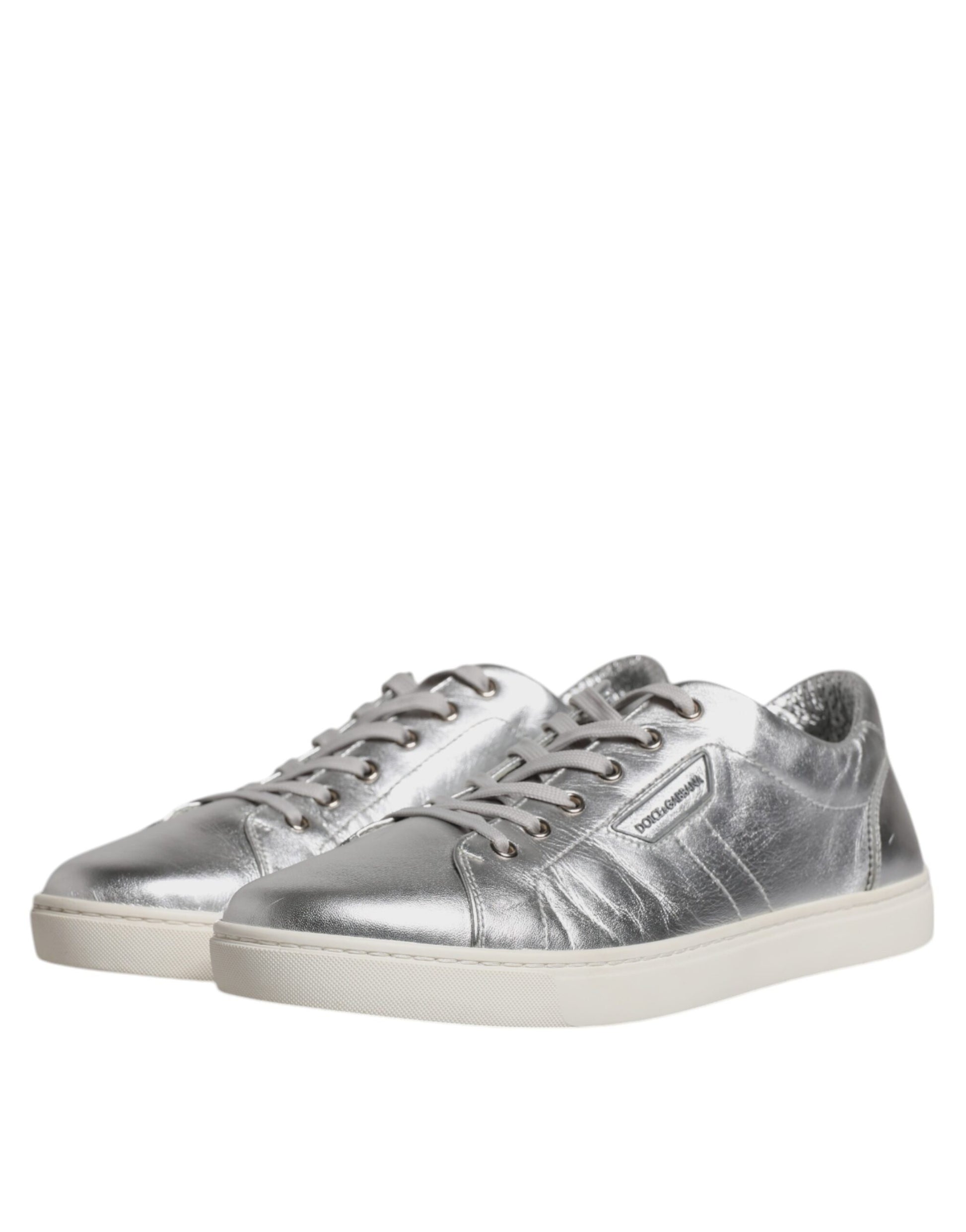 Silver leather sneakers with laces, featuring a low top and a chunky sole