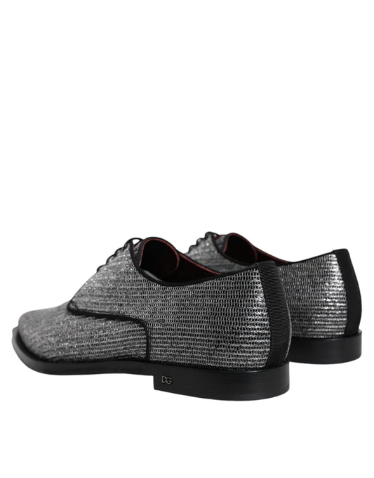 Pair of black dress shoes with a glittery texture