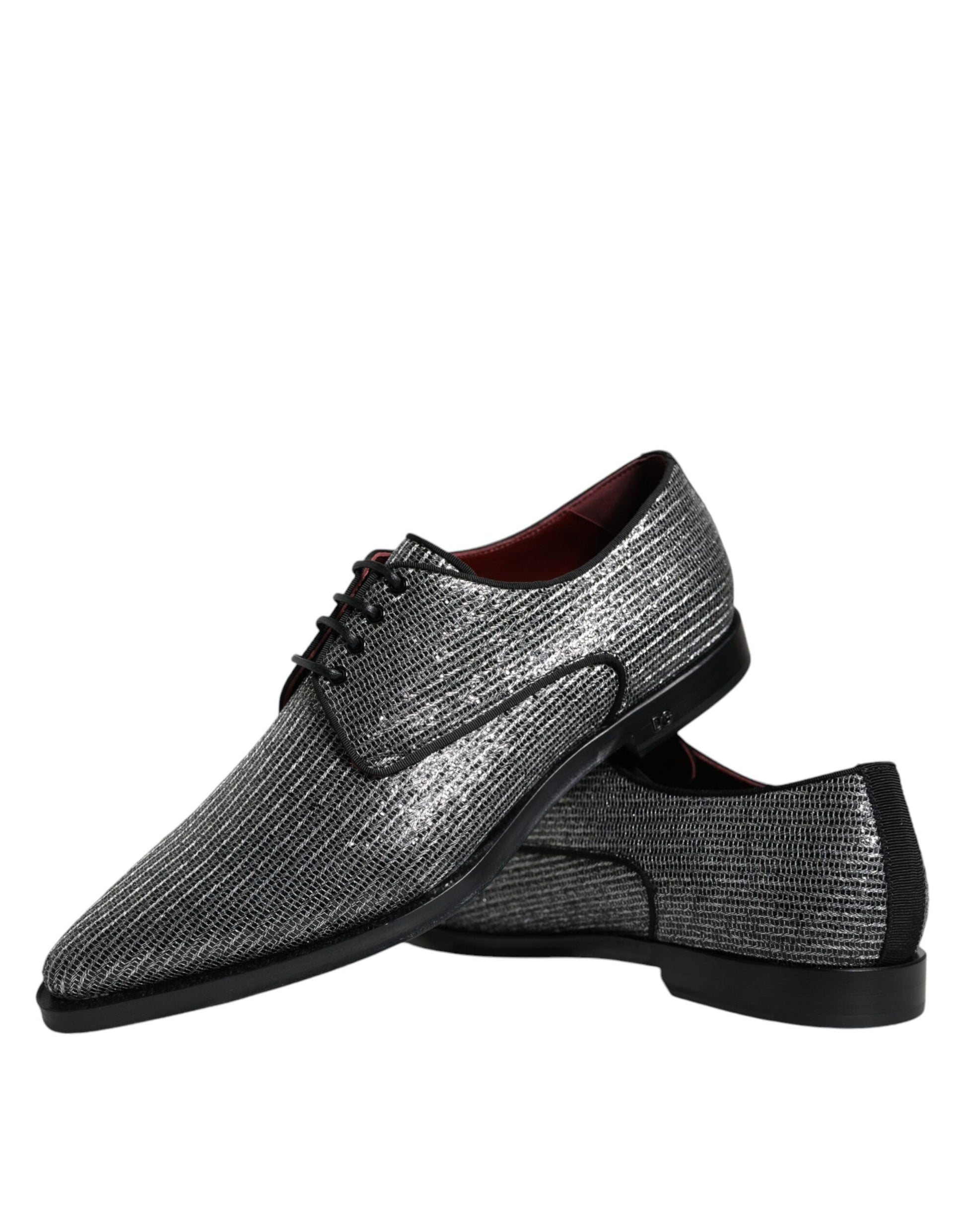 Pair of black patent shoes with red laces