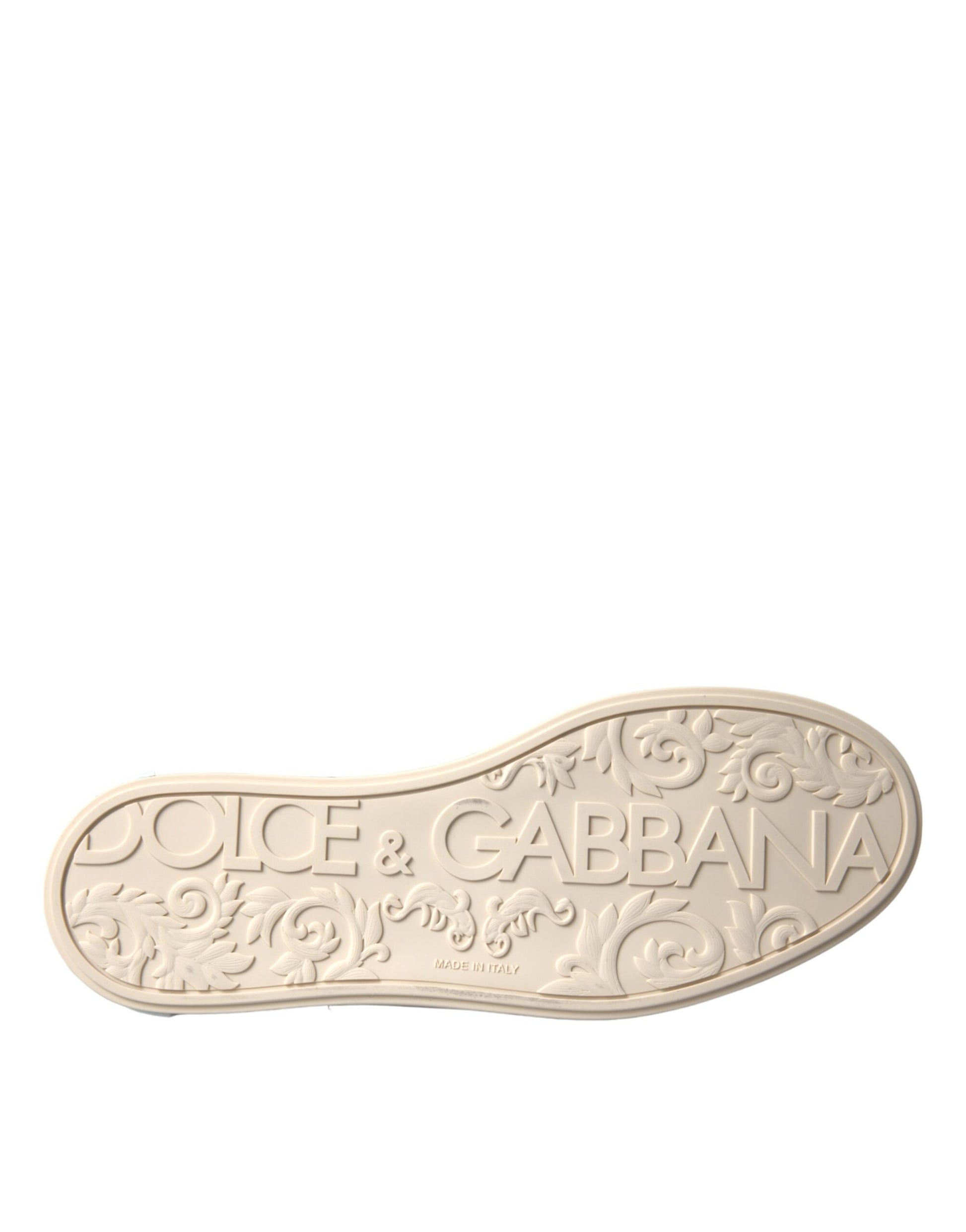 A shoe with an embossed design on its side. The design includes intricate patterns and the brand name GUCCI prominently d